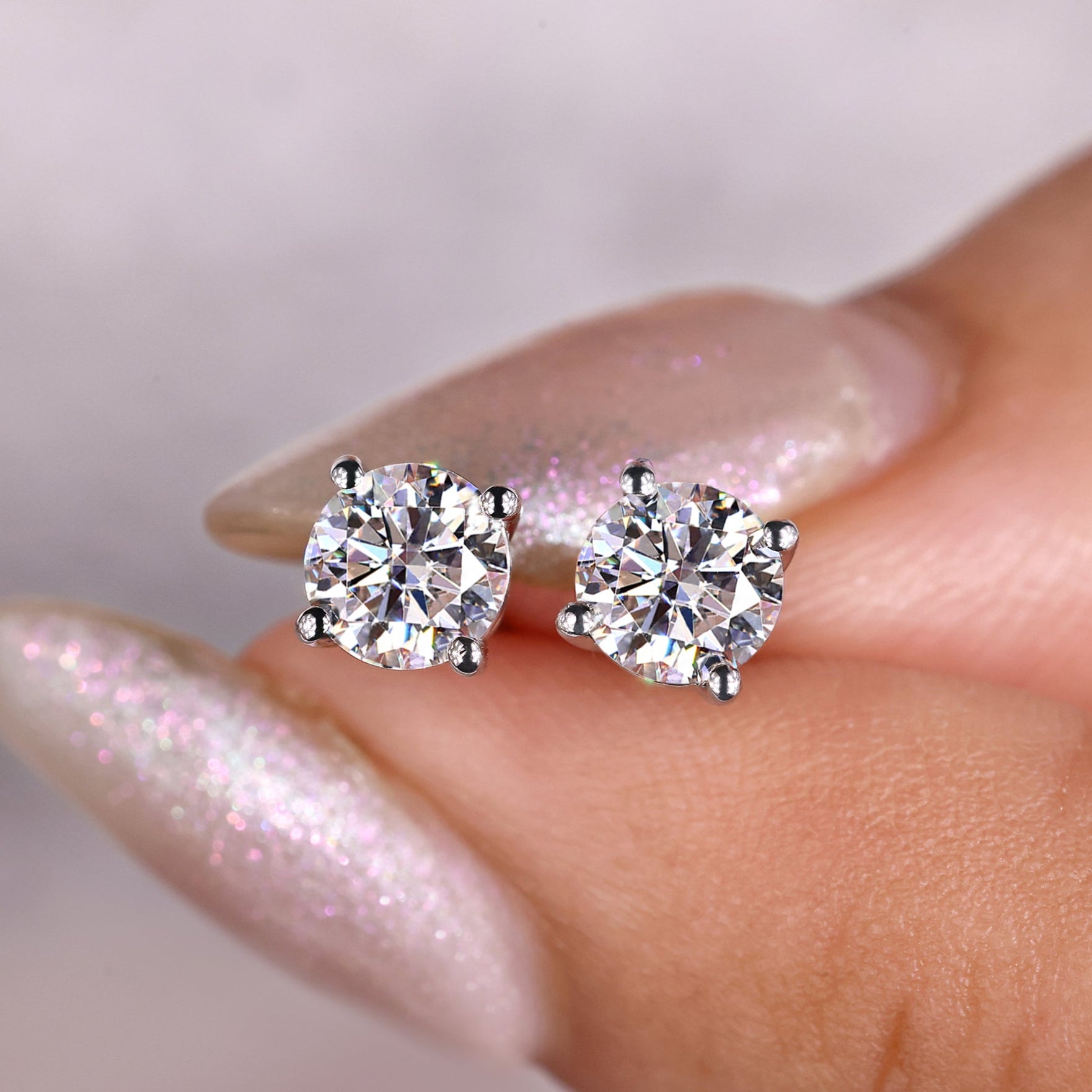 5mm moissanite stud earrings in 925 silver.