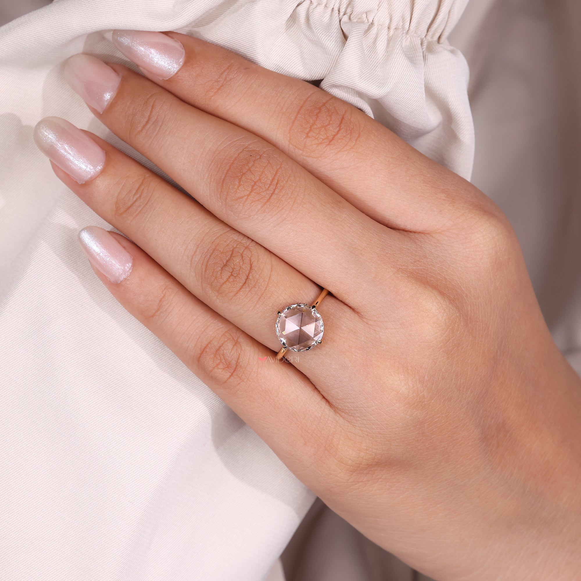 Diamond solitaire ring featuring a round diamond, designed for a clean and timeless look.
