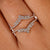 Double V-shaped wedding band in yellow gold.