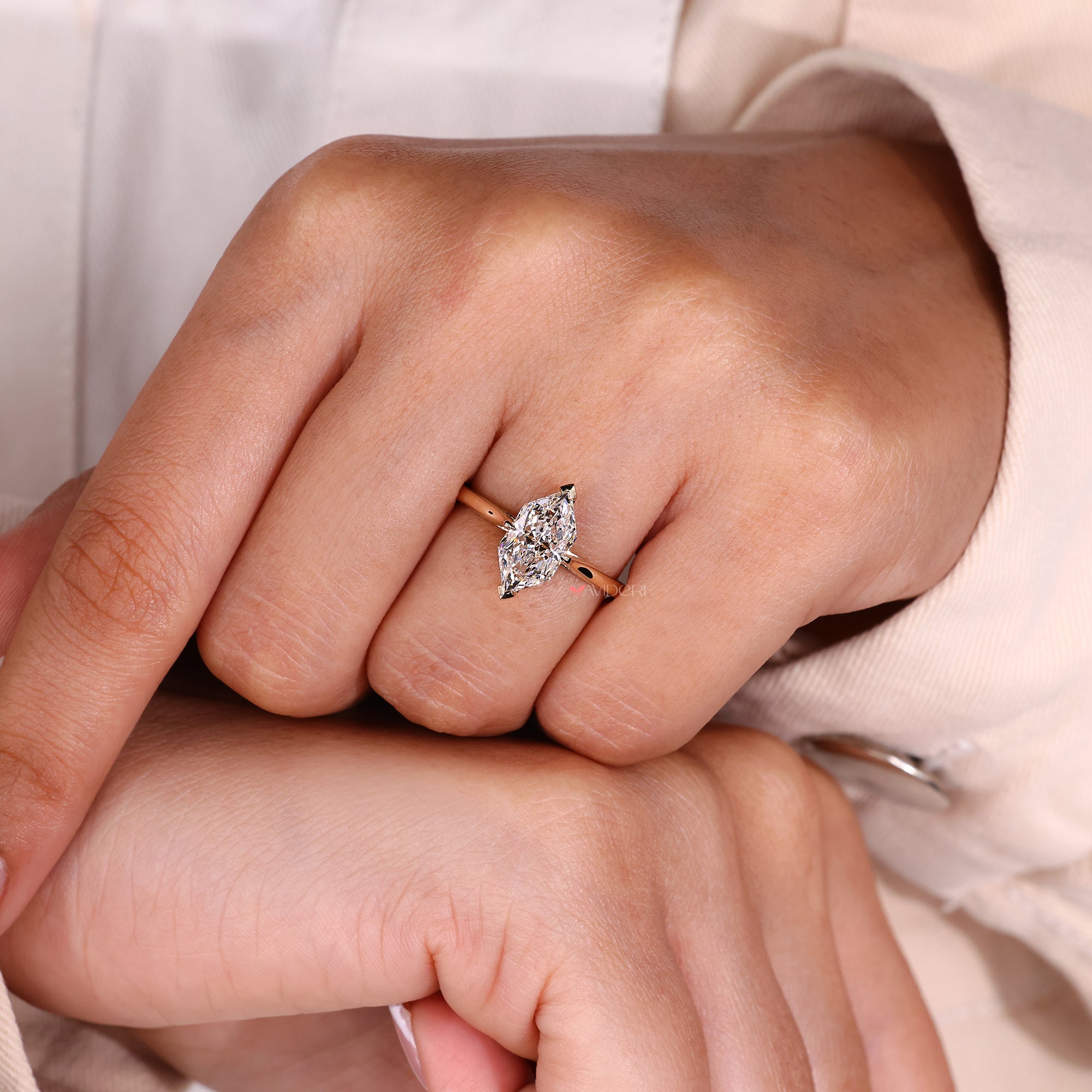 Yellow gold ring with hidden halo design.
