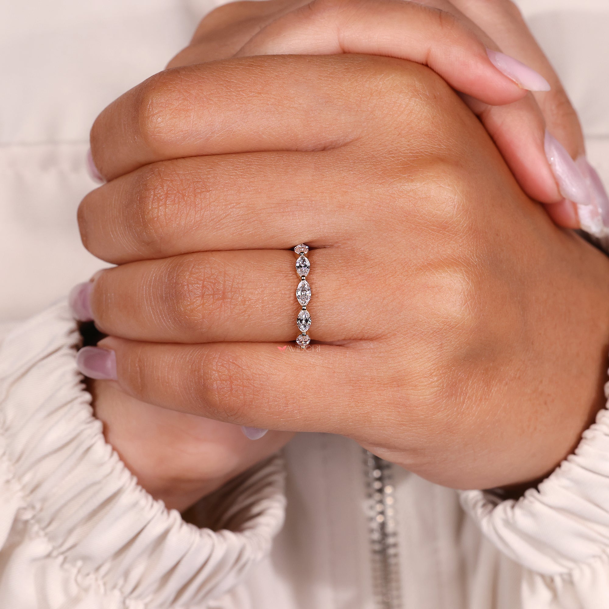 Delicate diamond band with marquise diamonds in prong setting.