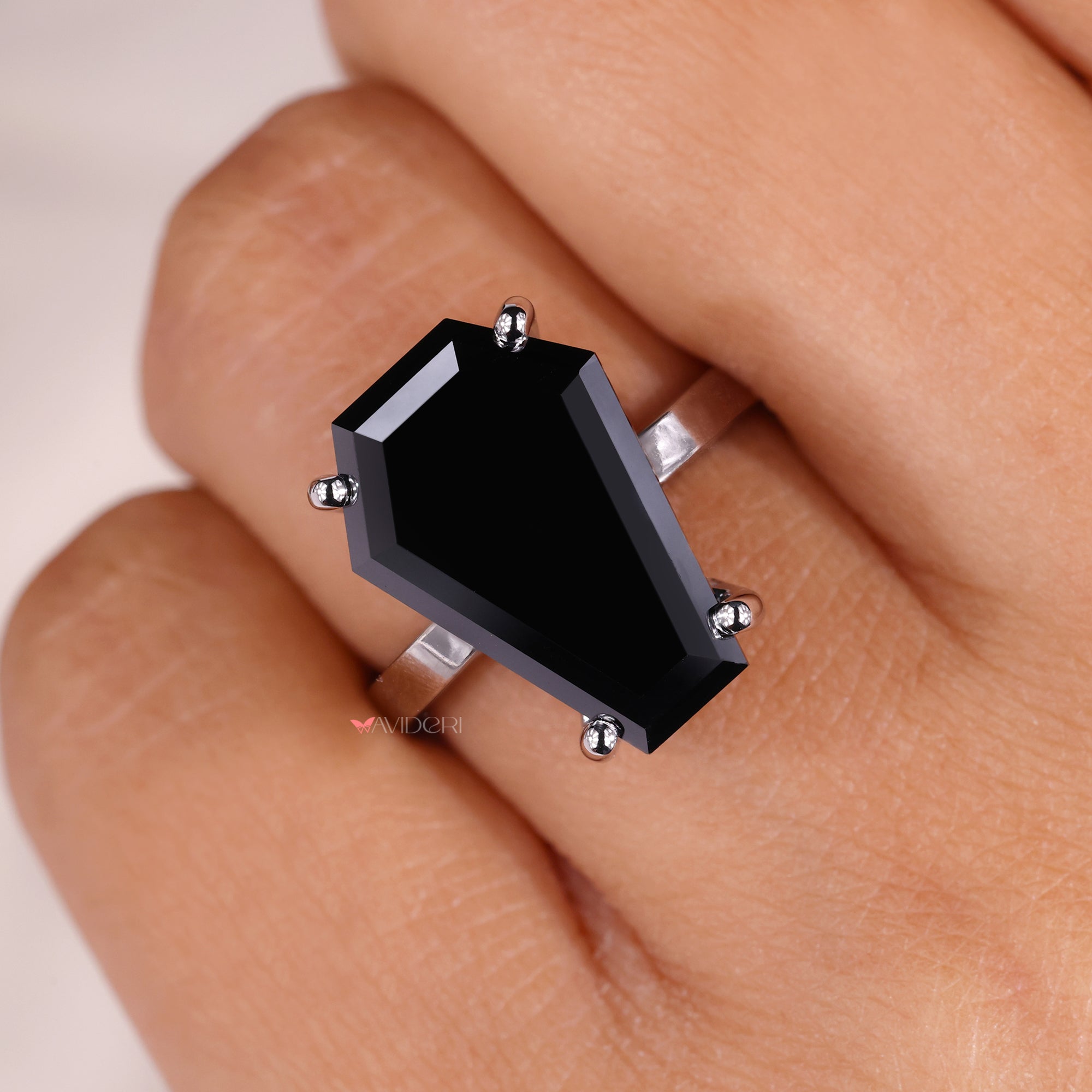 Coffin shape adds unique style to the ring.