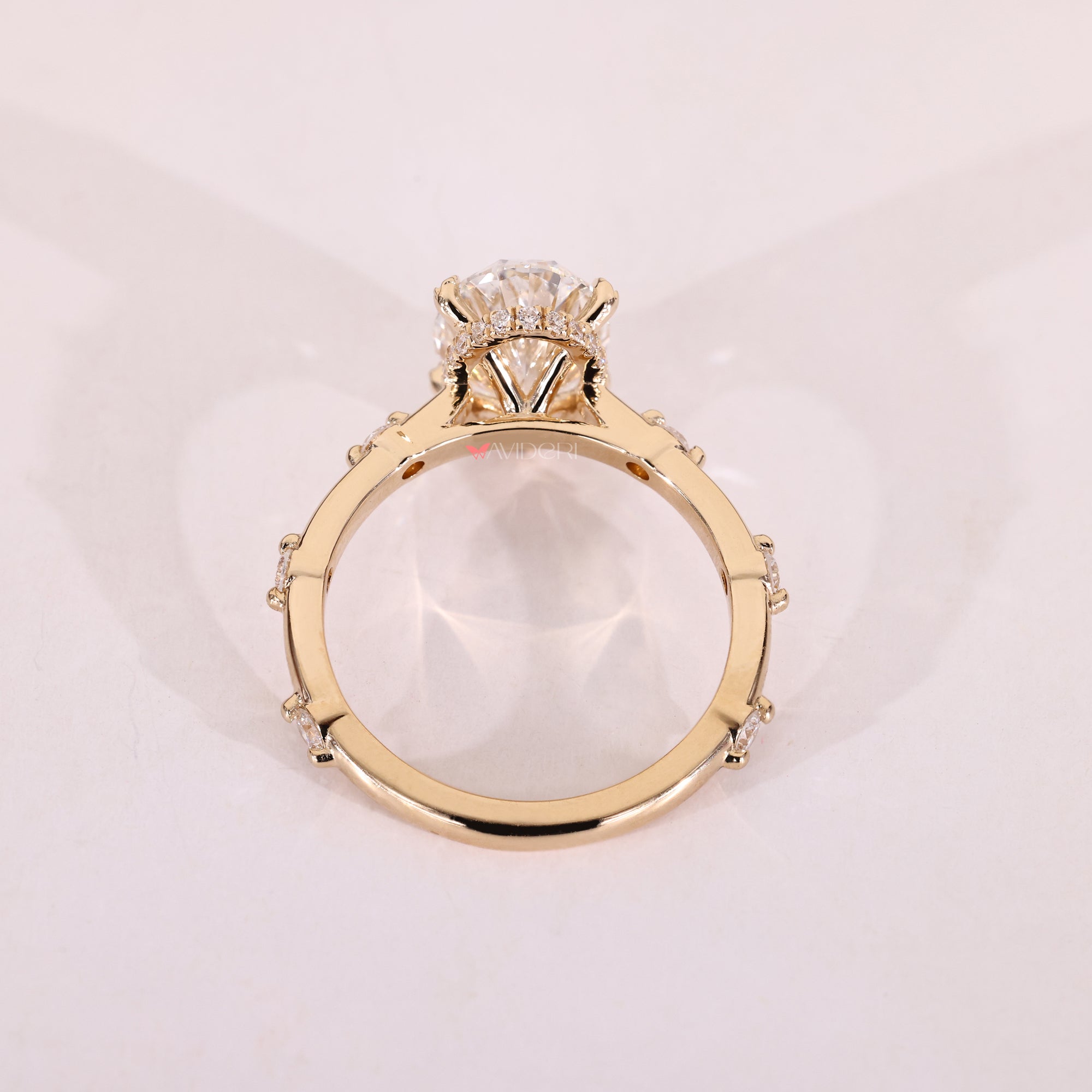 Cathedral ring setting lifts diamond to catch more light.
