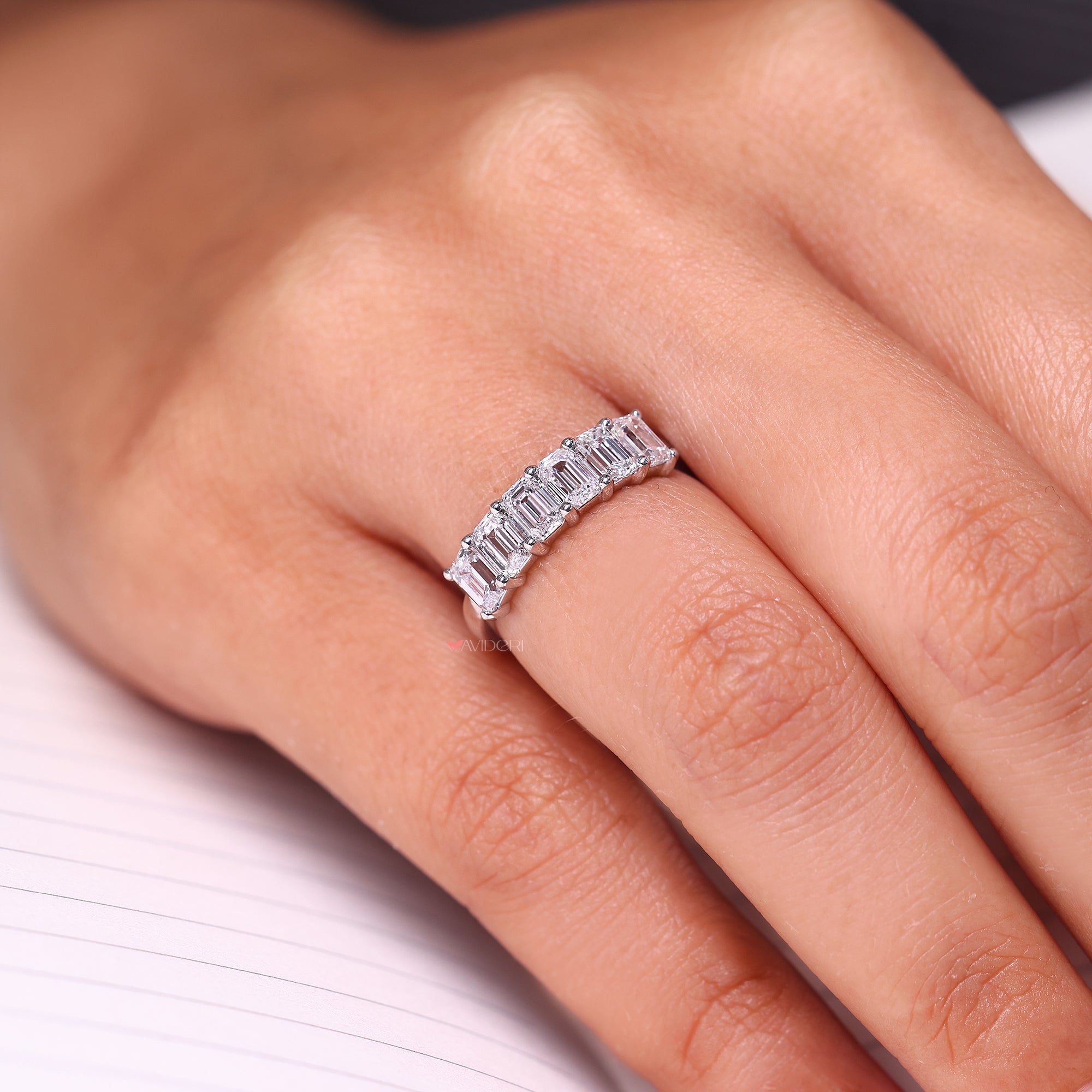 7 stone wedding band with shared prong wedding band.