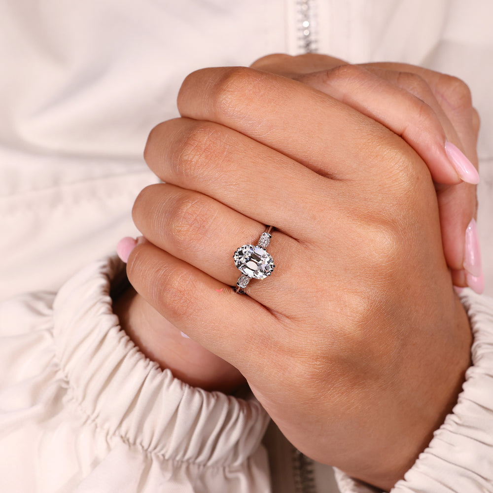 Lab-grown diamond cushion Old European Cut ring with marquise shape side outline.