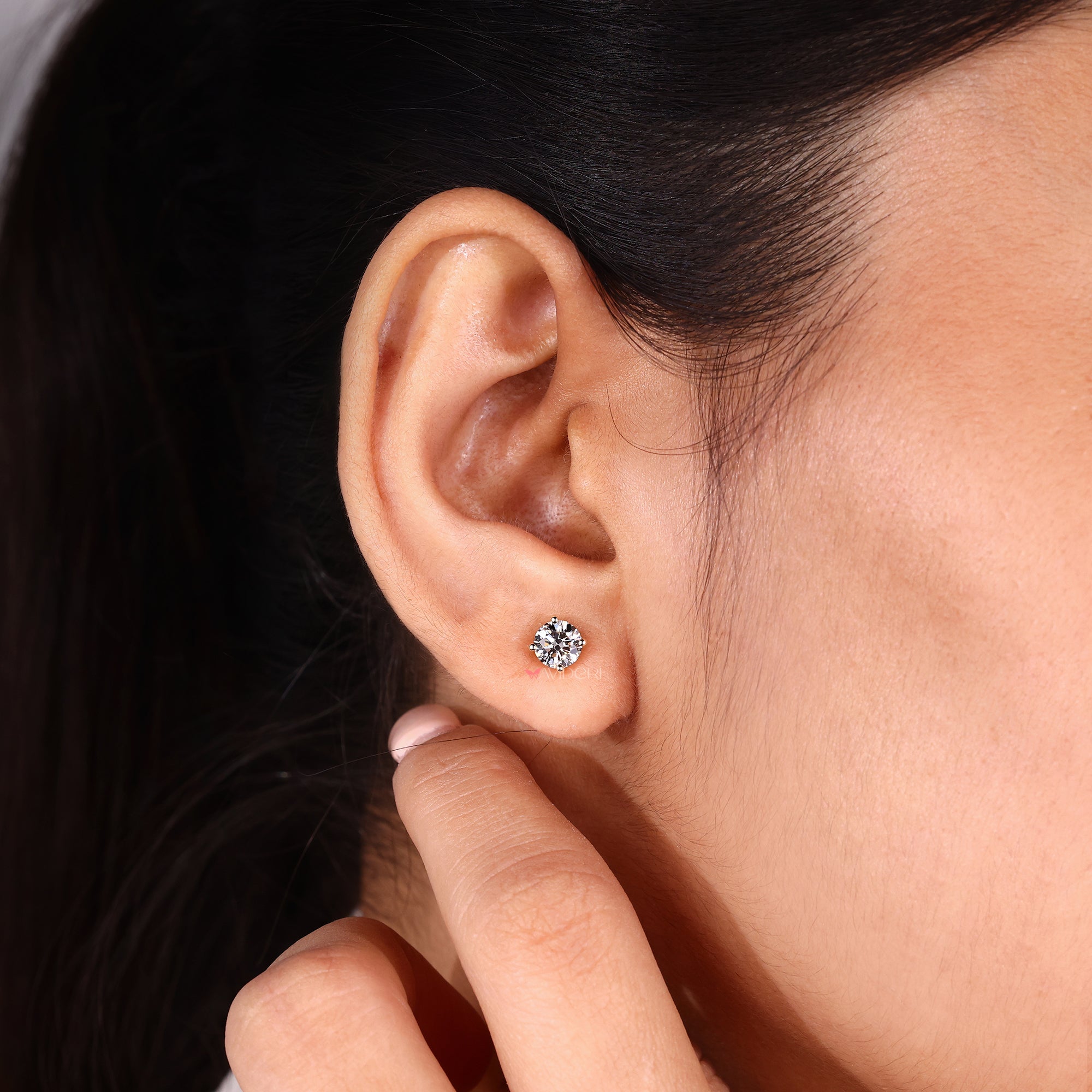 Solitaire diamond earrings for everyday wear.