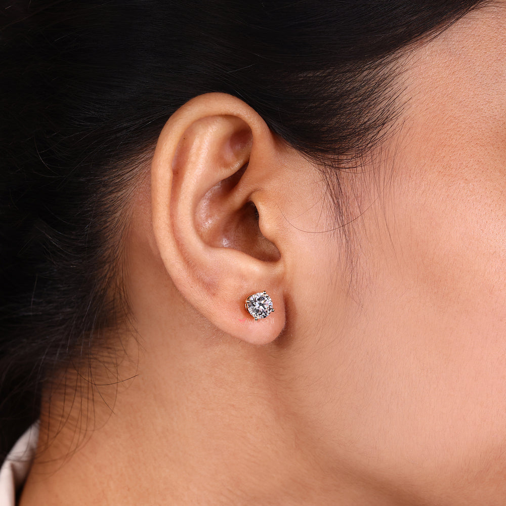 Round diamond stud earrings for everyday wear.