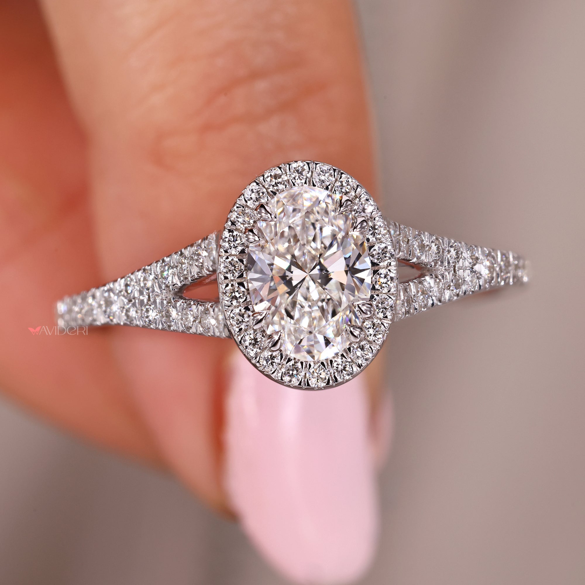 Double claw prong setting in white gold engagement ring.