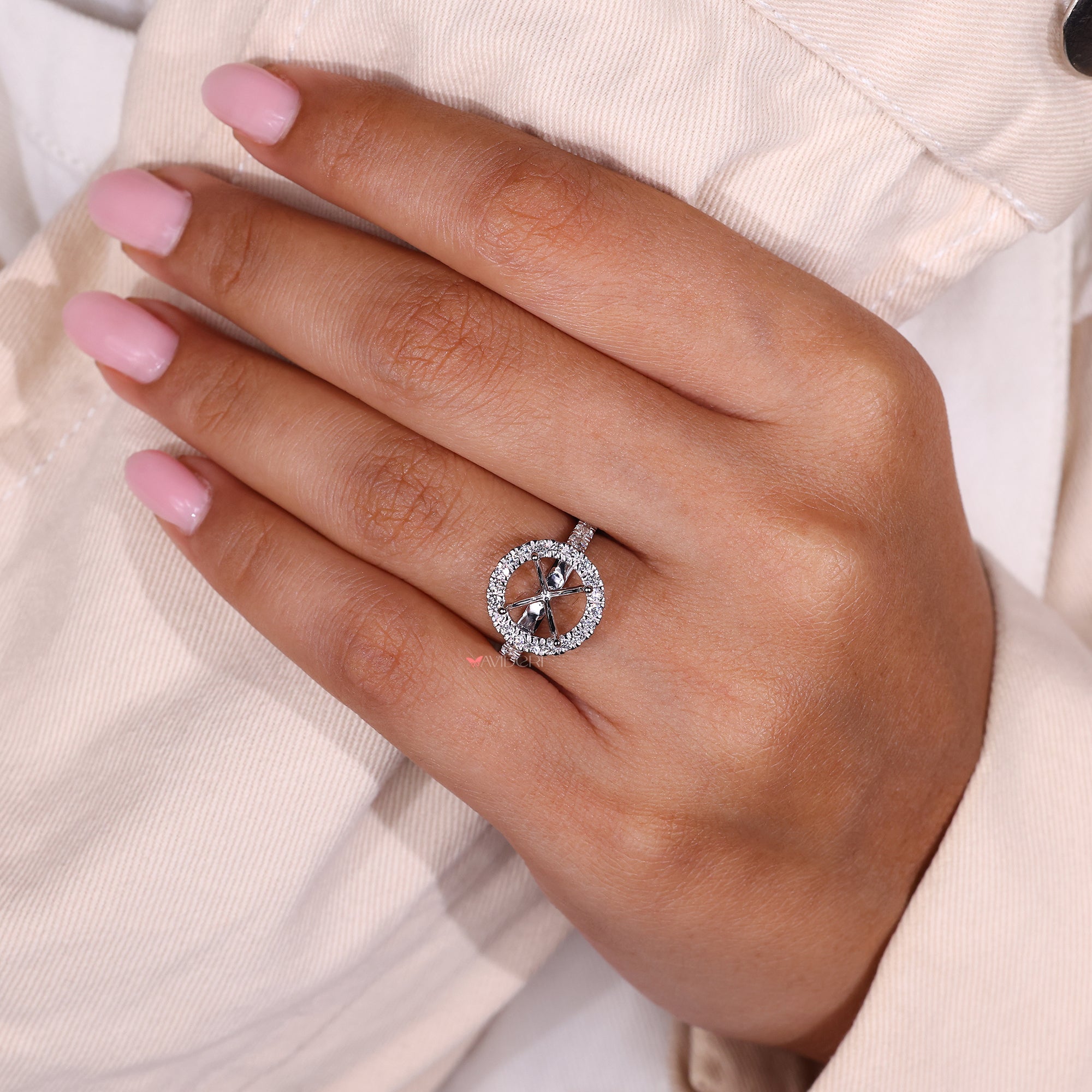 Four-prong set engagement ring in classic cathedral design.
