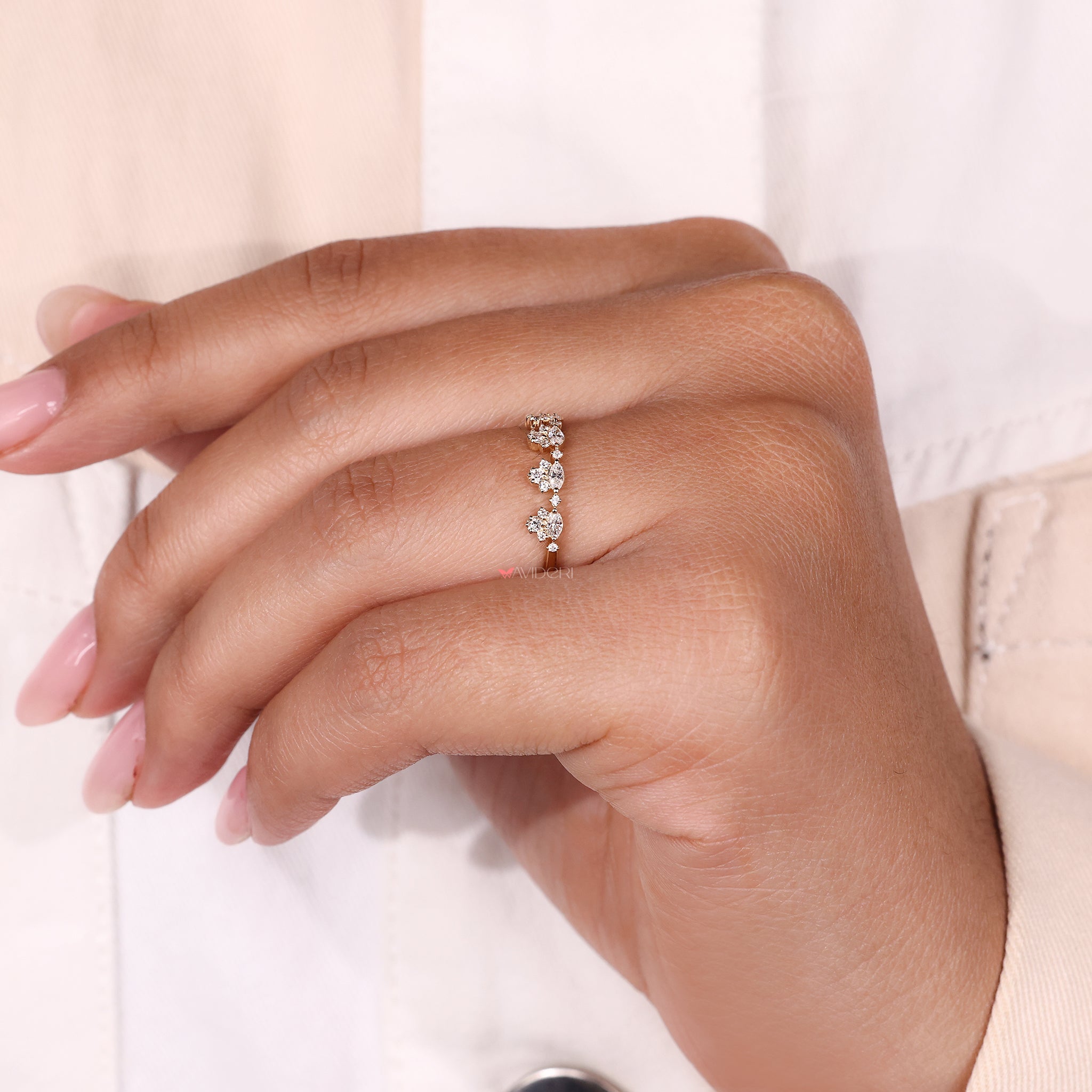 Tapered shank wedding band with shared prong round diamonds for smooth stacking.
