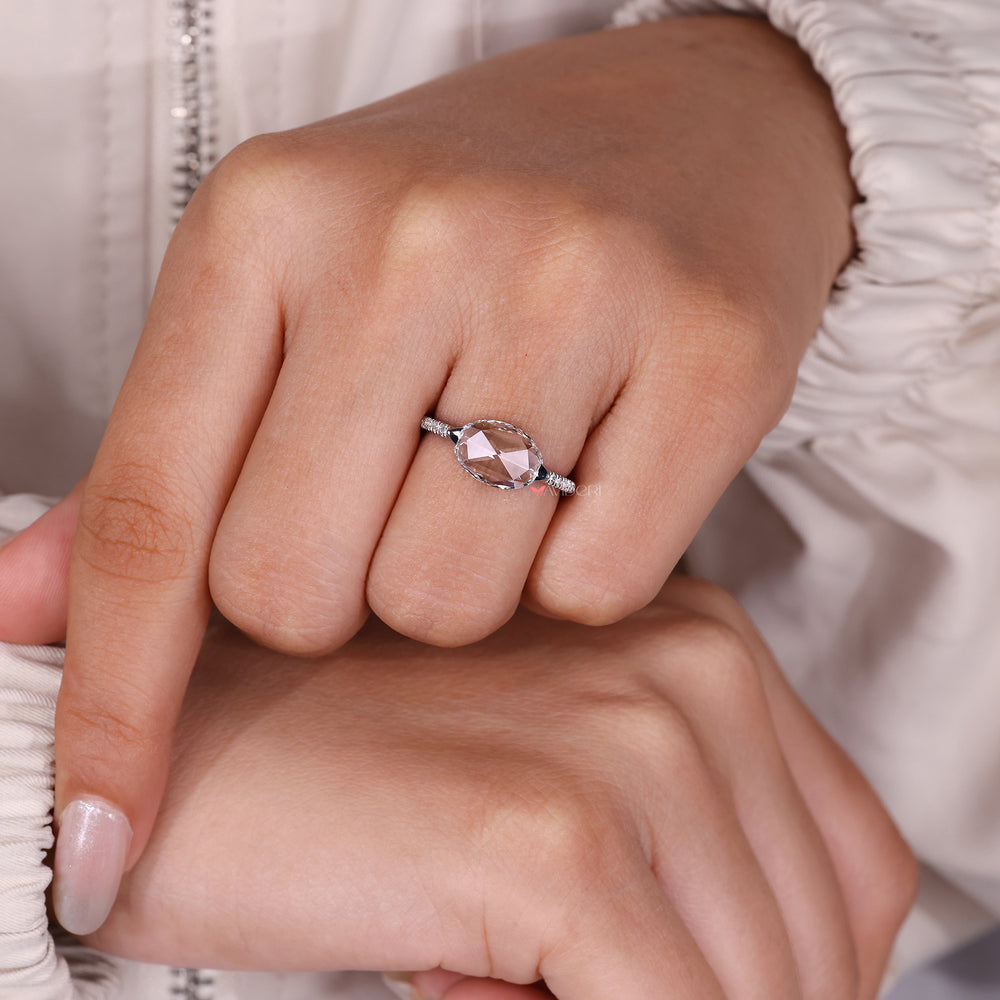 East west engagement ring with oval rose cut diamond.