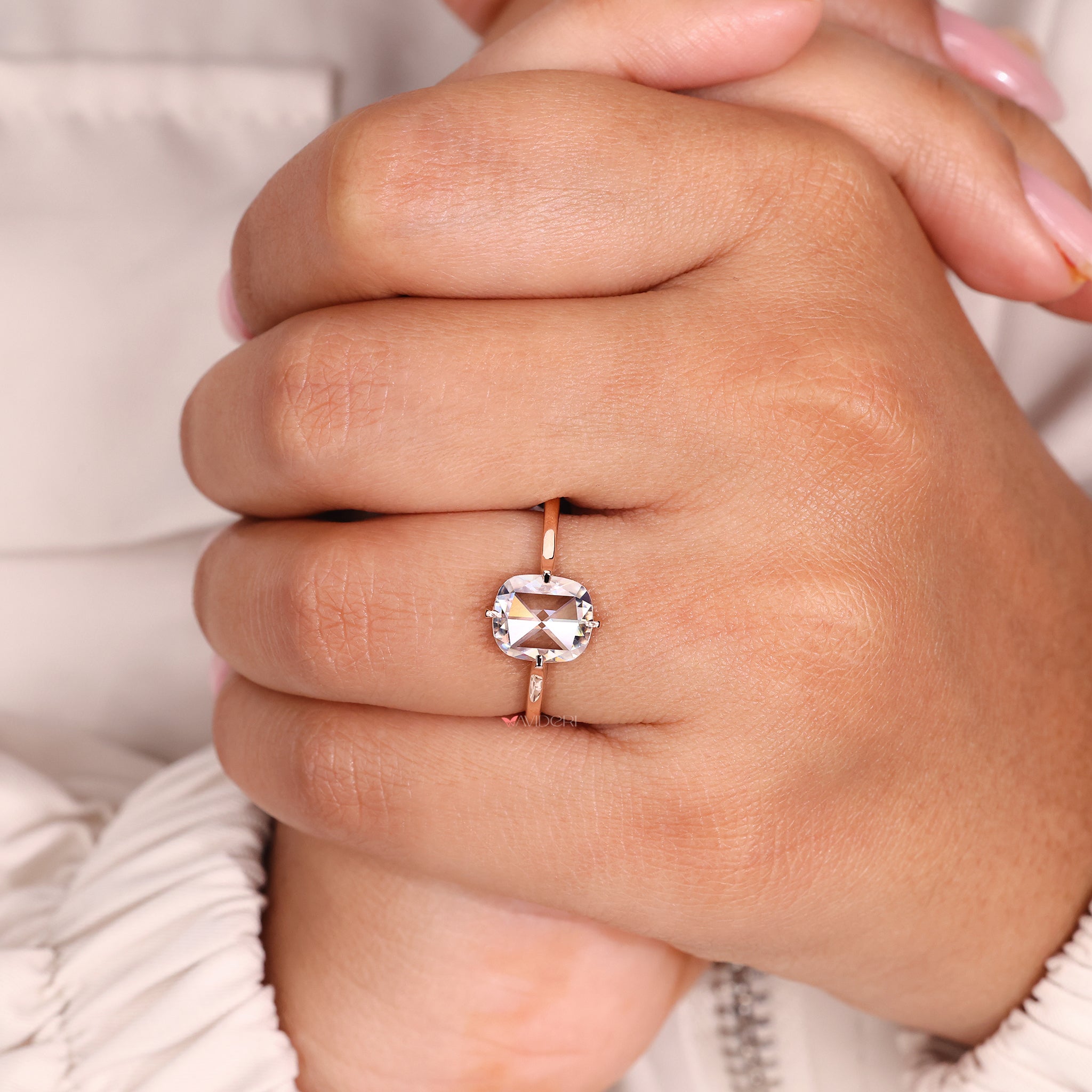 Moissanite engagement ring in solitaire style with a rose cut cushion stone.
