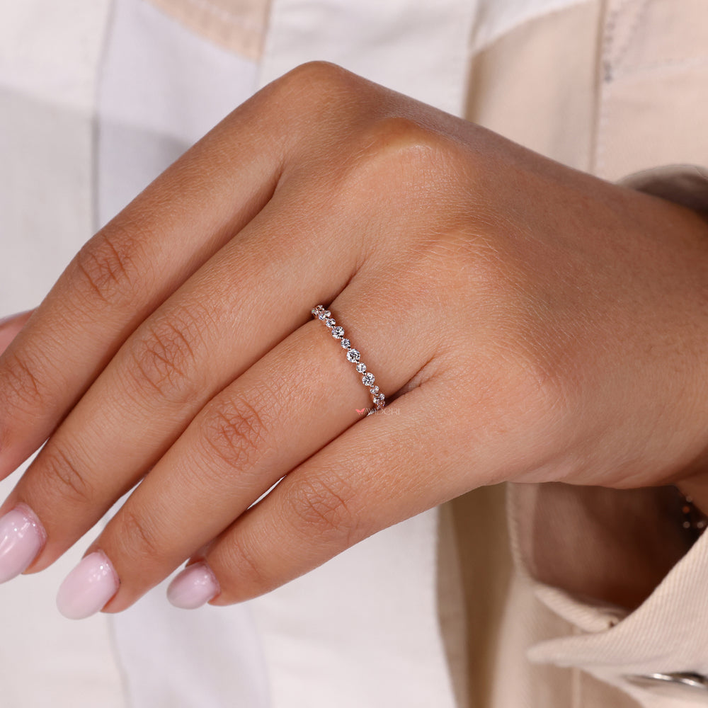 Round diamond eternity band set in a gold eternity band for a classic look.

Rose gold wedding band with a round diamond eternity band for a dazzling finish.
