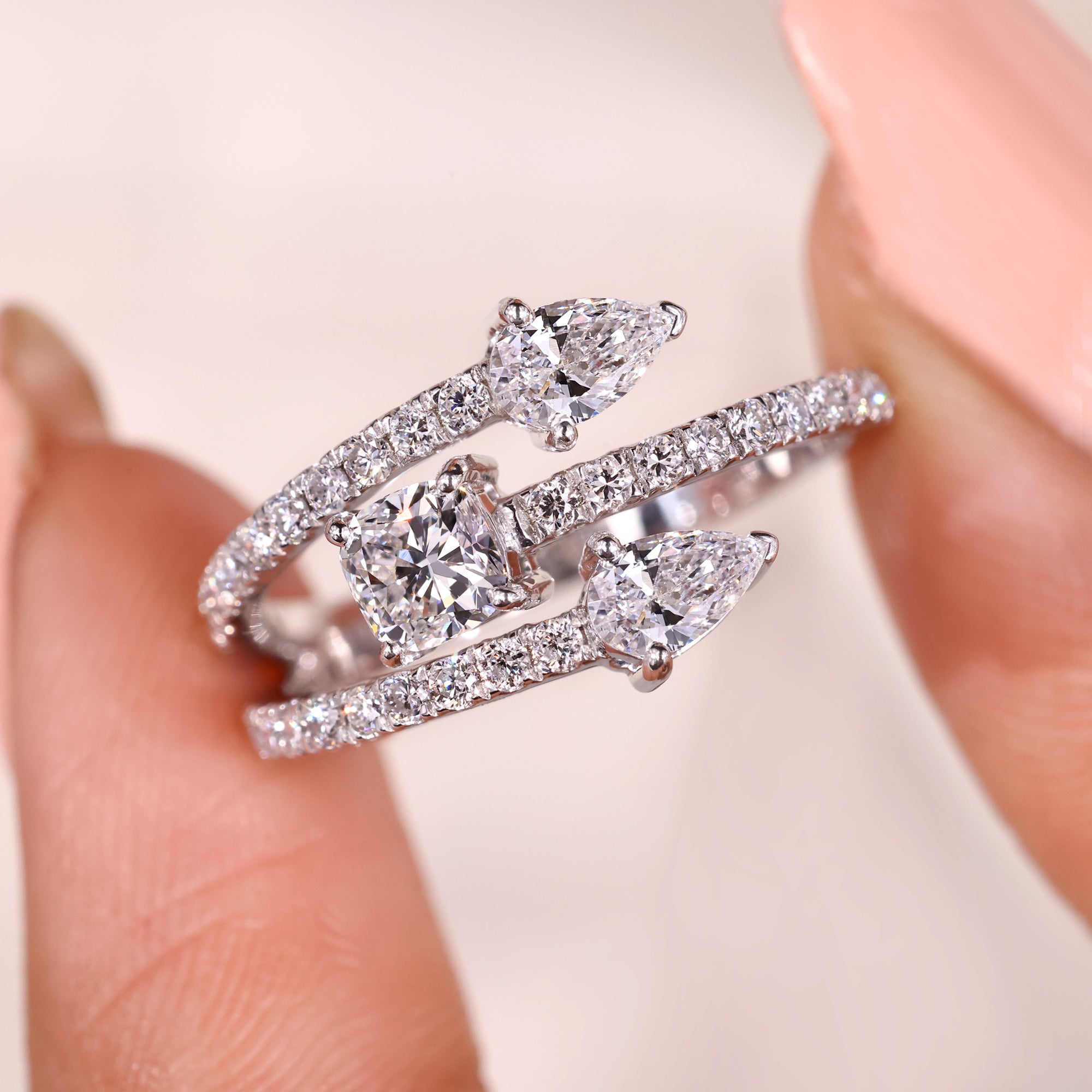 Pear diamond engagement ring with prong setting.