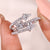Pear diamond engagement ring with prong setting.