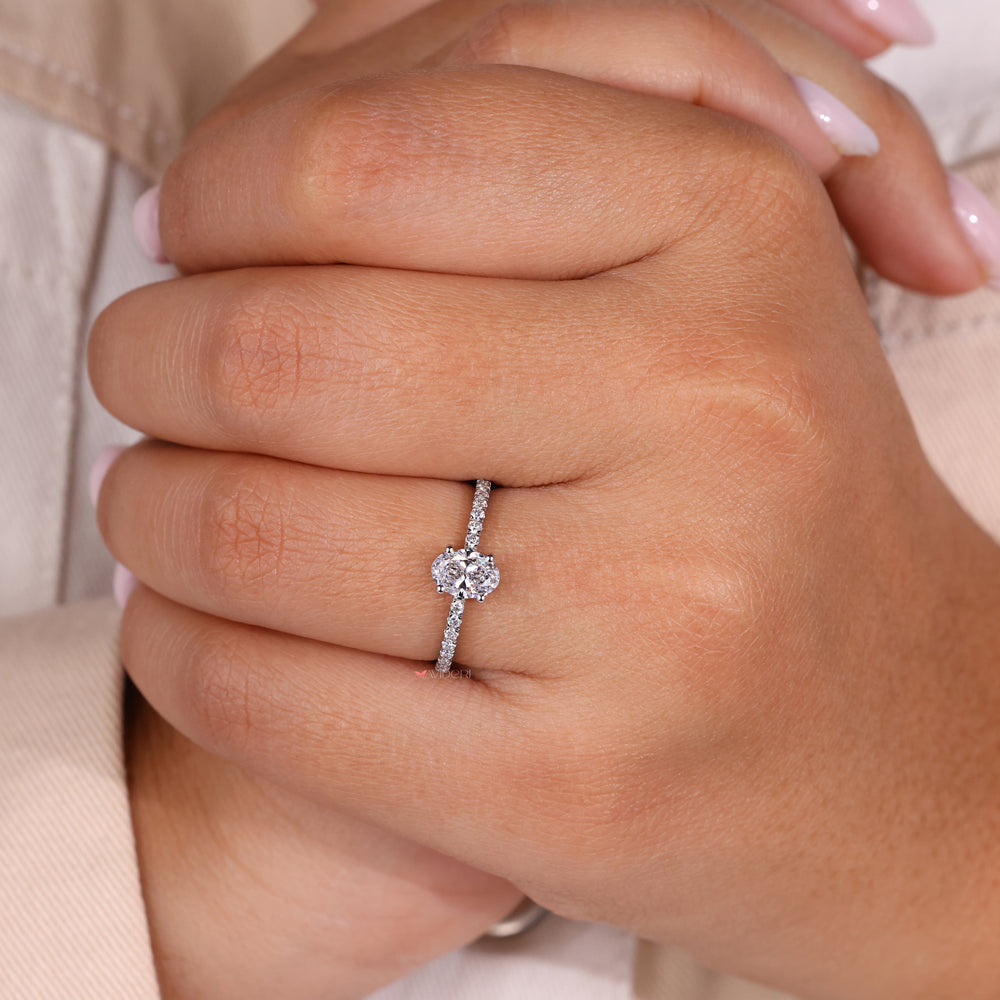 Handmade ring featuring an oval shaped engagement ring for a unique touch.
