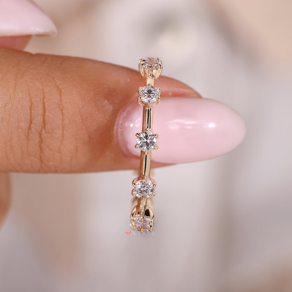 Pave band ring with round diamonds set in a classic wedding band style.
