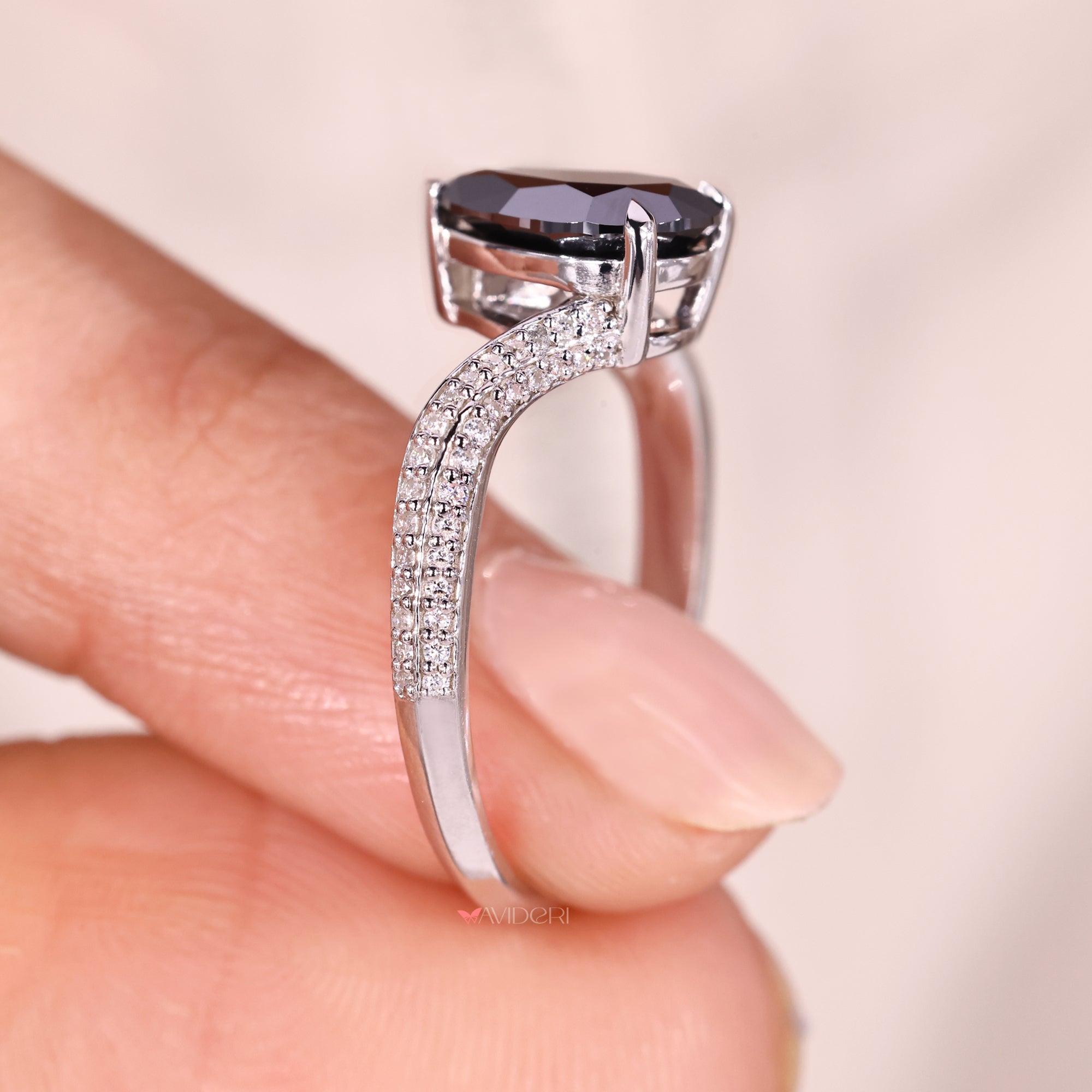 Two row pave set ring with intricate diamond detailing.