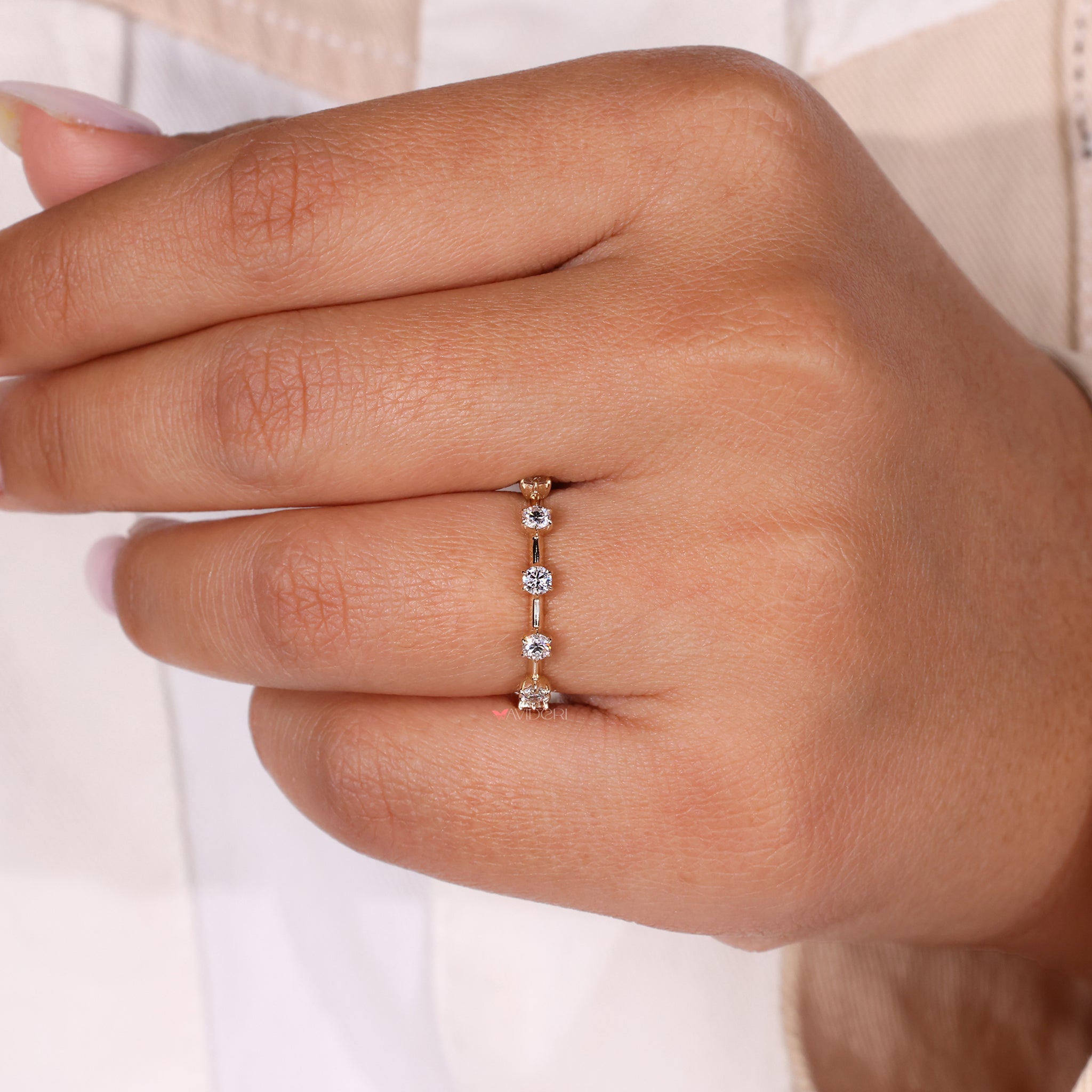Handmade band featuring round diamonds in a classic round diamond wedding band.
