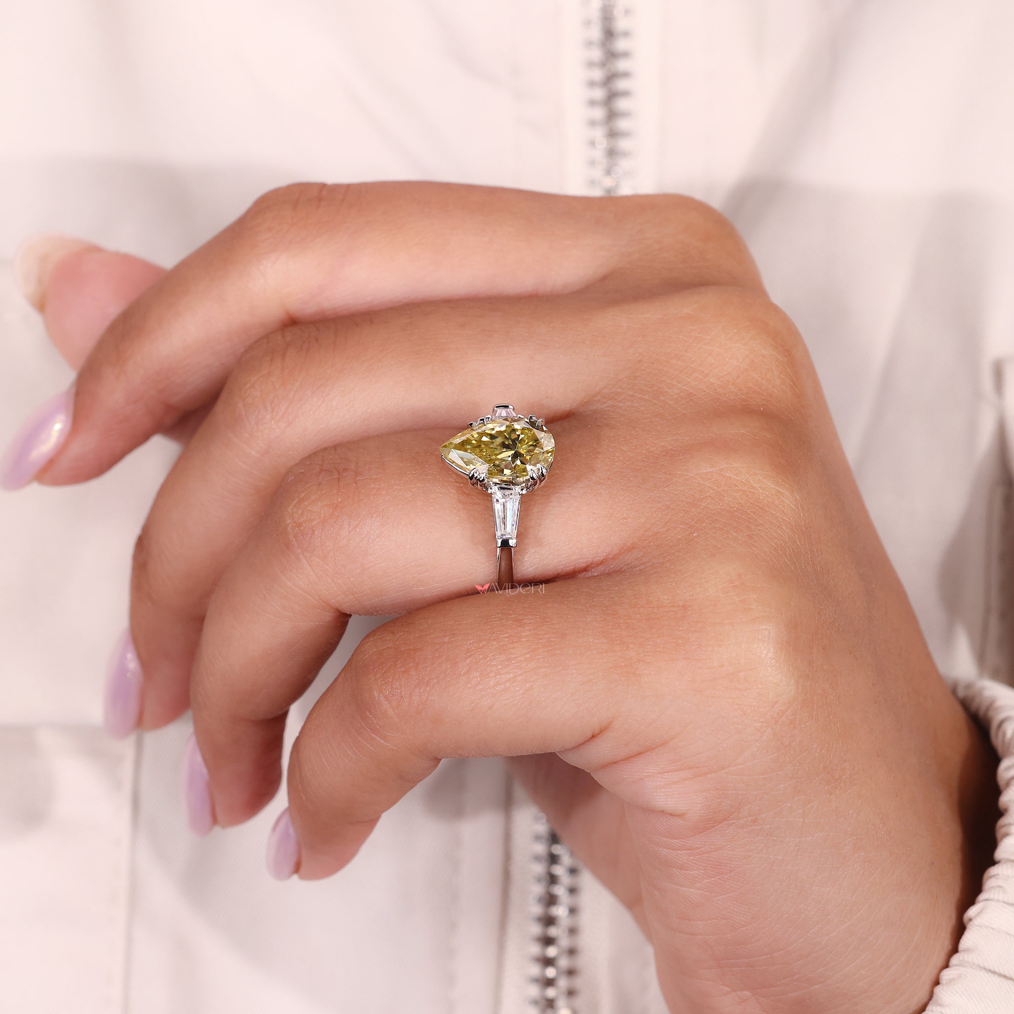 Canary Yellow pear cut moissanite ring with bar setting and handmade detailing.
