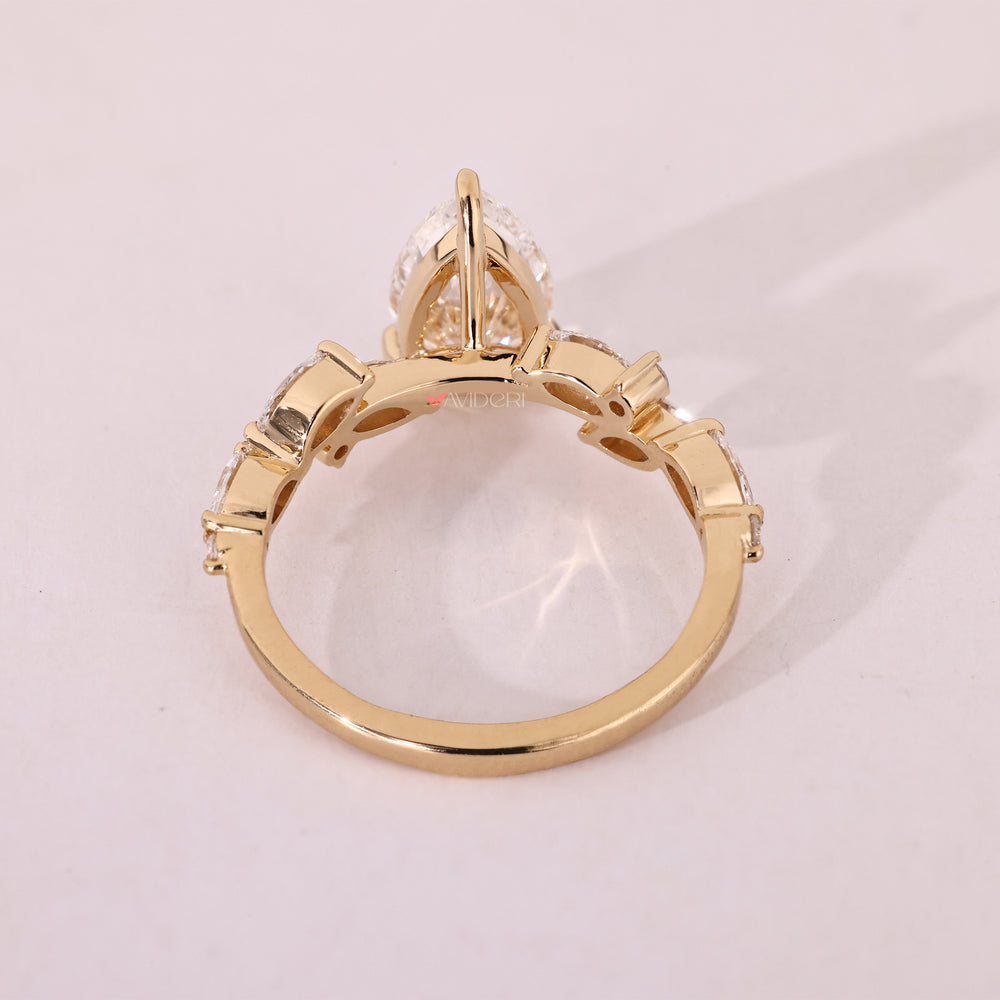Round side diamond engagement ring featuring lab grown diamonds in a classic style.
