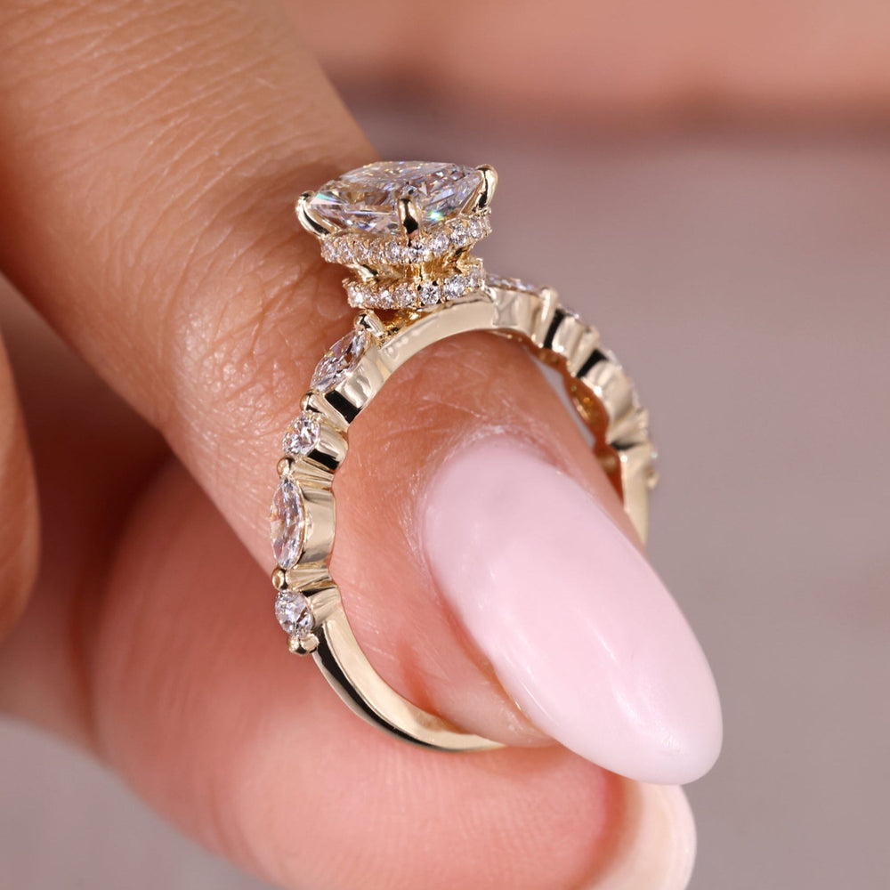 Radiant engagement ring with radiant cut ring and marquise side stones.
