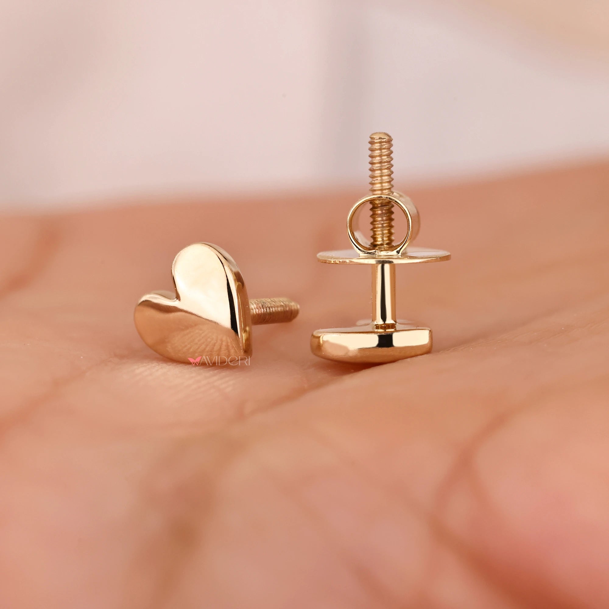 Screw back stud earrings with gold earrings.