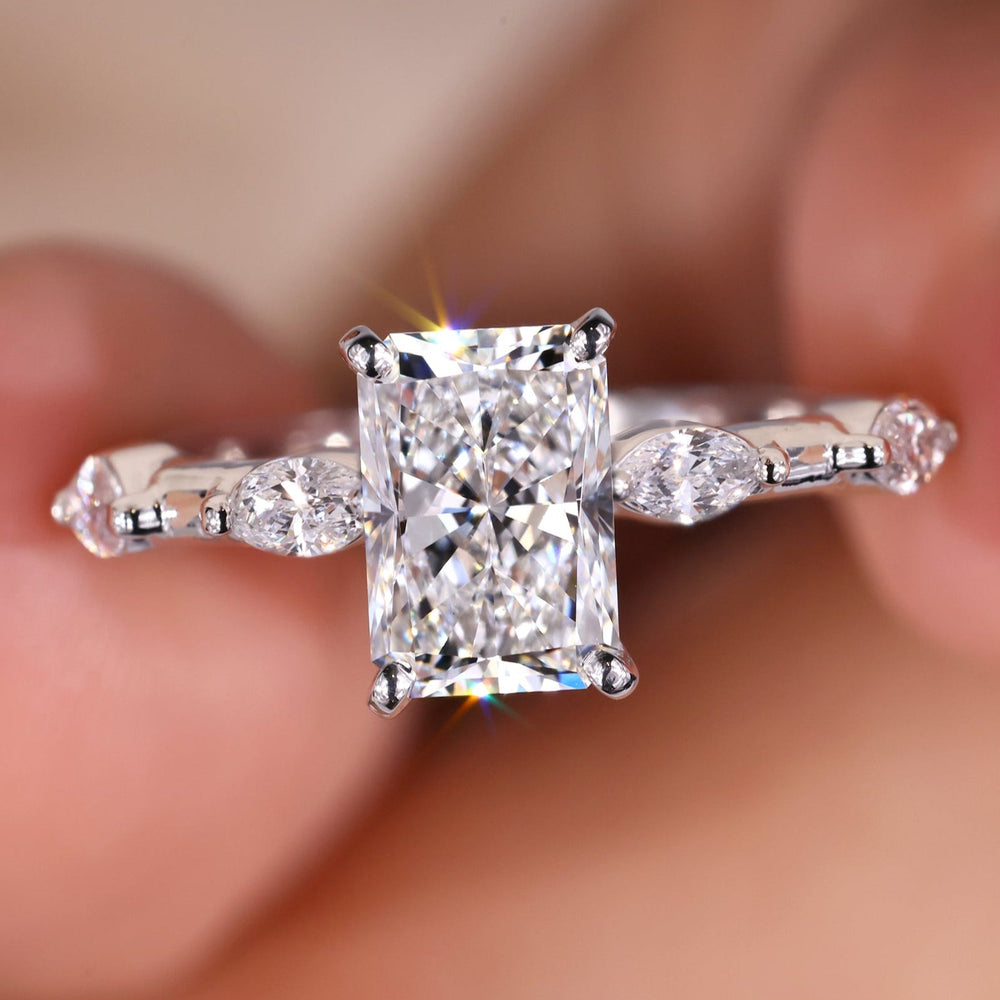 Radiant engagement ring featuring a radiant cut moissanite ring design.
