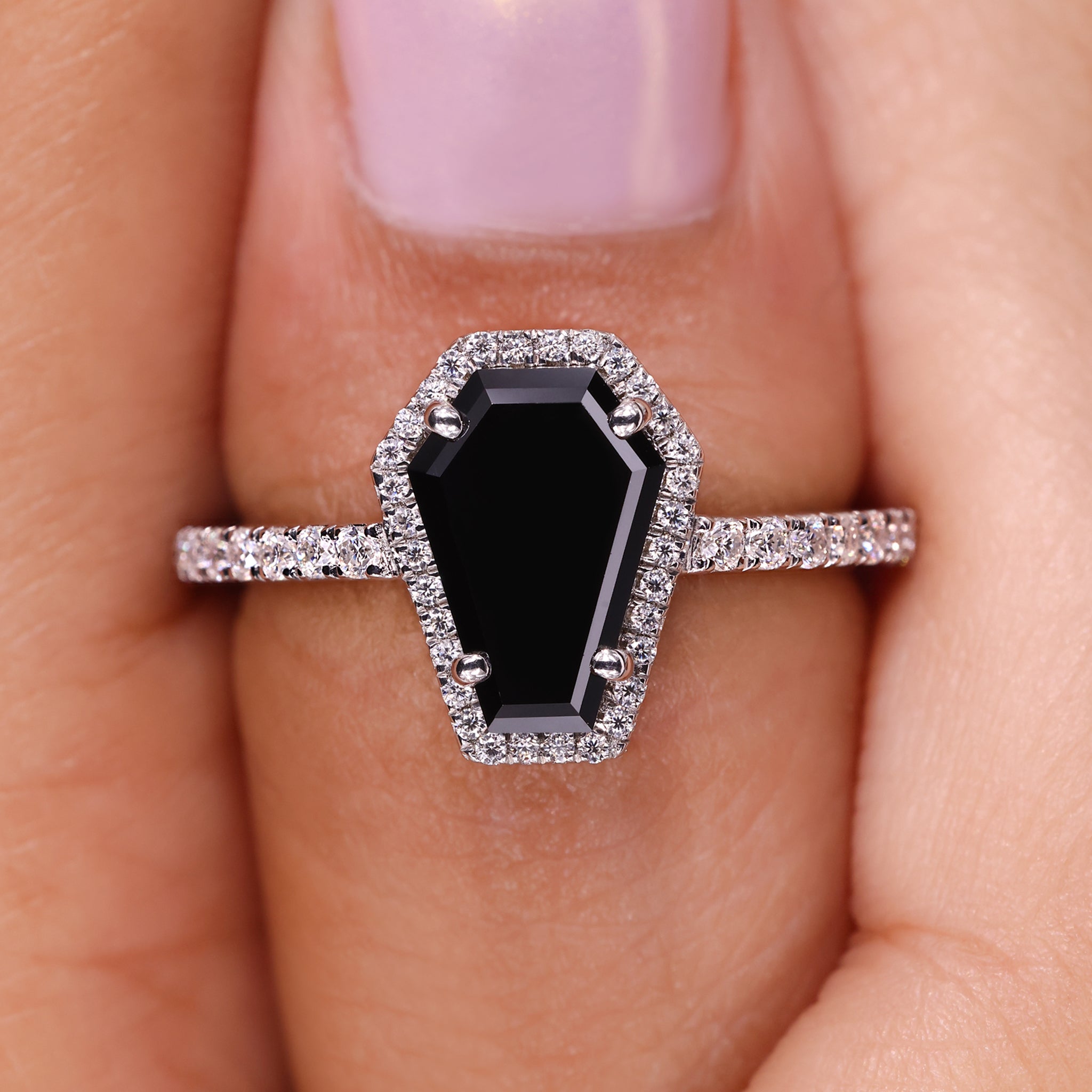 4 prong setting offers secure support to the center stone.