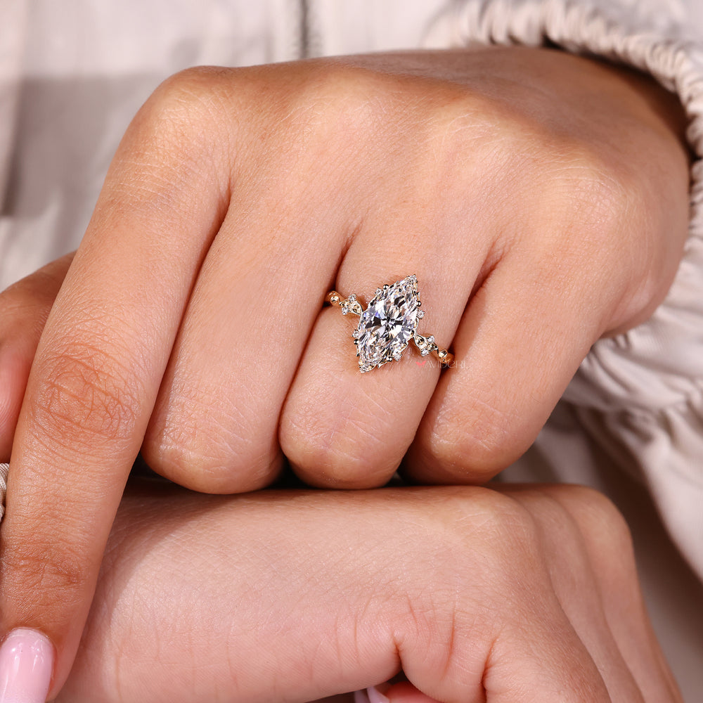 Diamond cluster ring with marquise center stone.