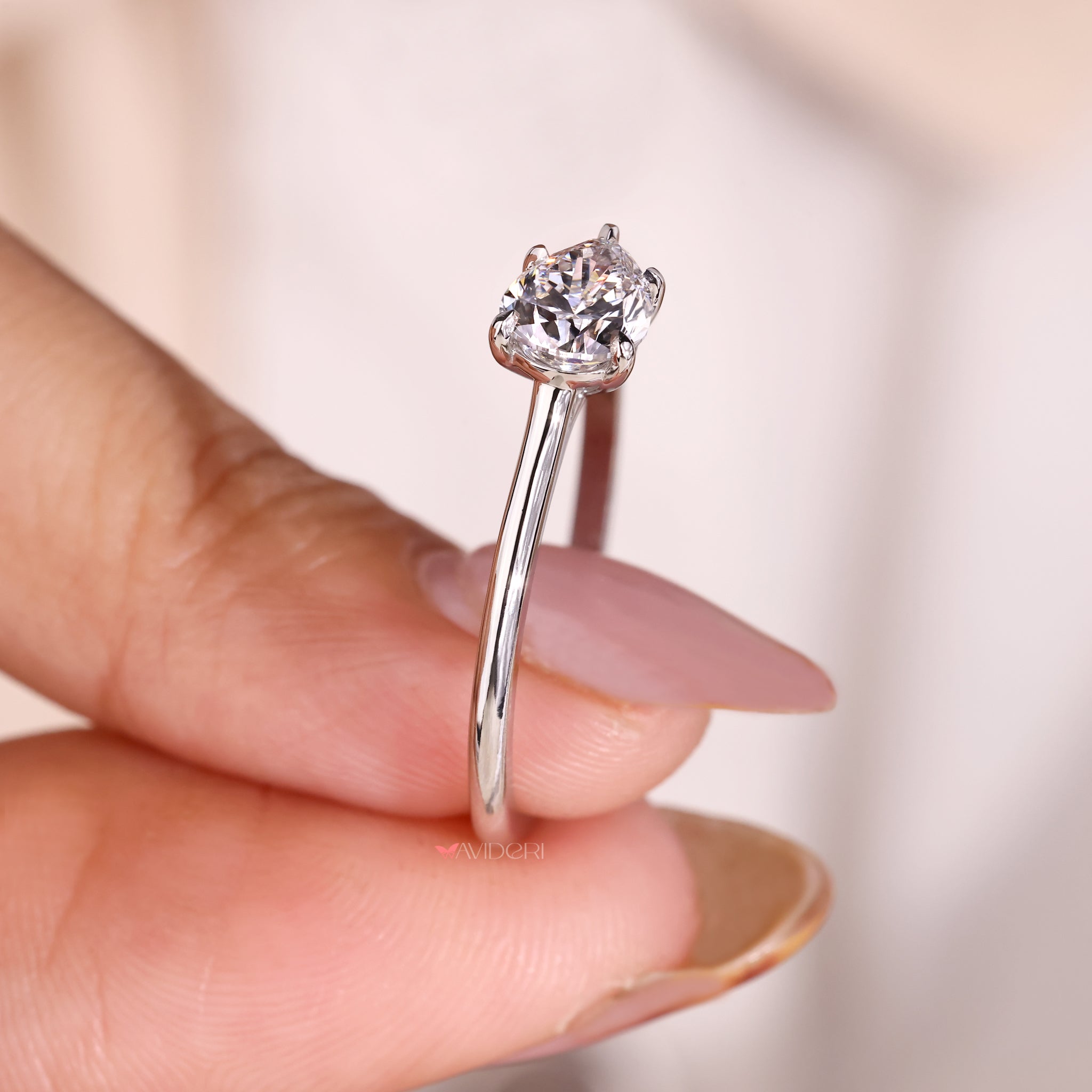 Claw Prong Pear Ring providing a secure and stylish setting for the diamond.