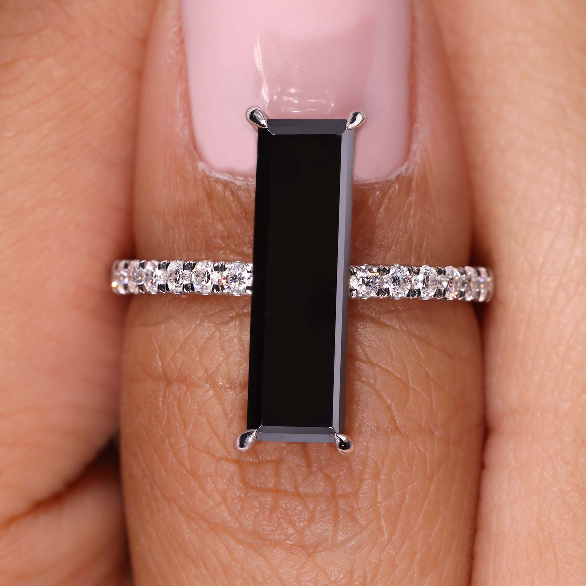 Baguette moissanite ring with sleek gold band.