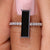 Baguette moissanite ring with sleek gold band.