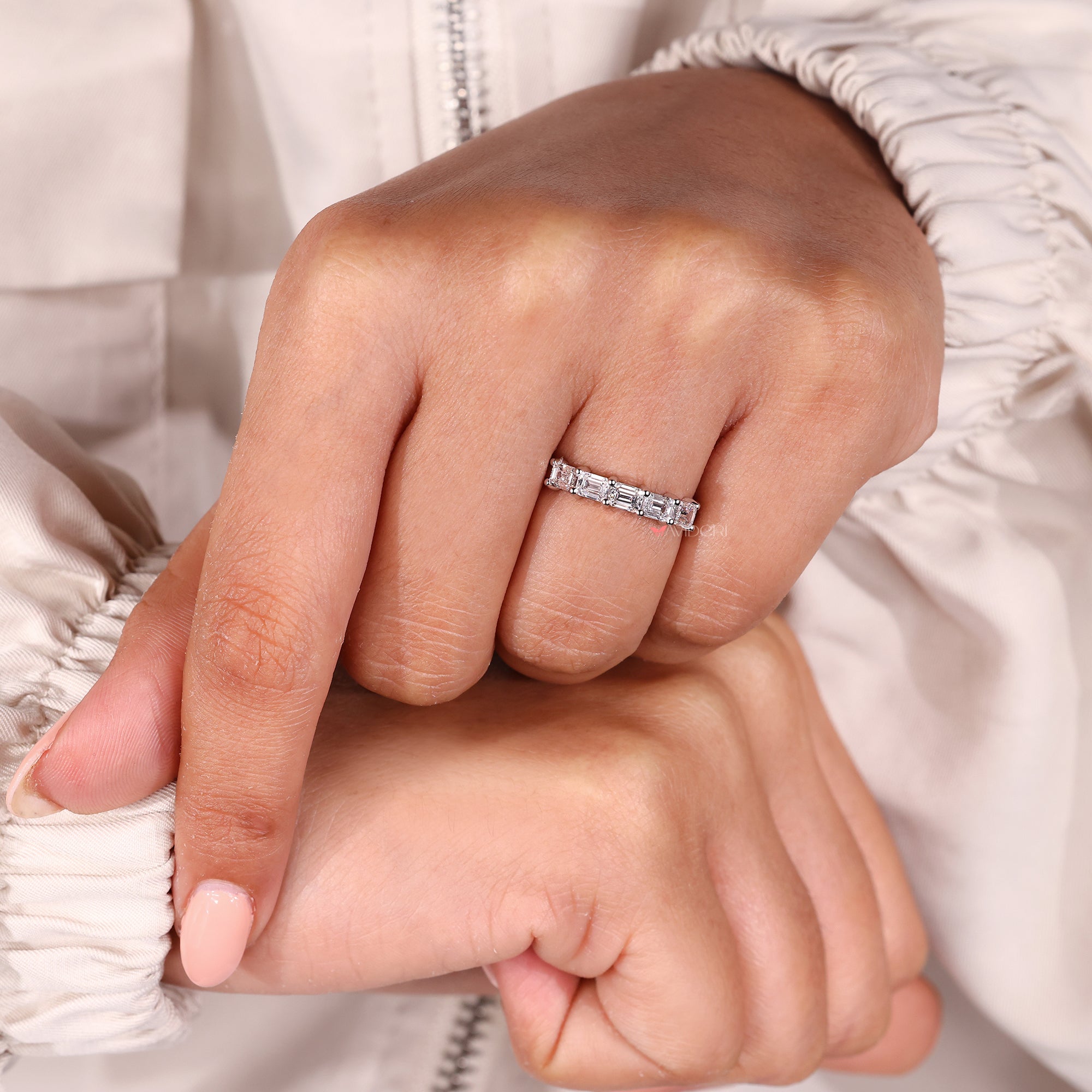 Buy a wedding band with five diamonds set in a row.
