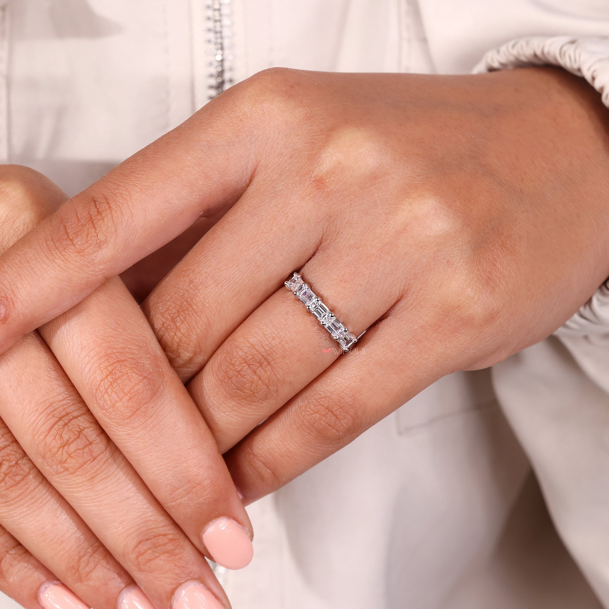 Shared prong setting band with neatly placed diamonds.