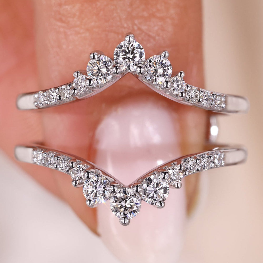 Curved diamond wrap band in shared prong setting.