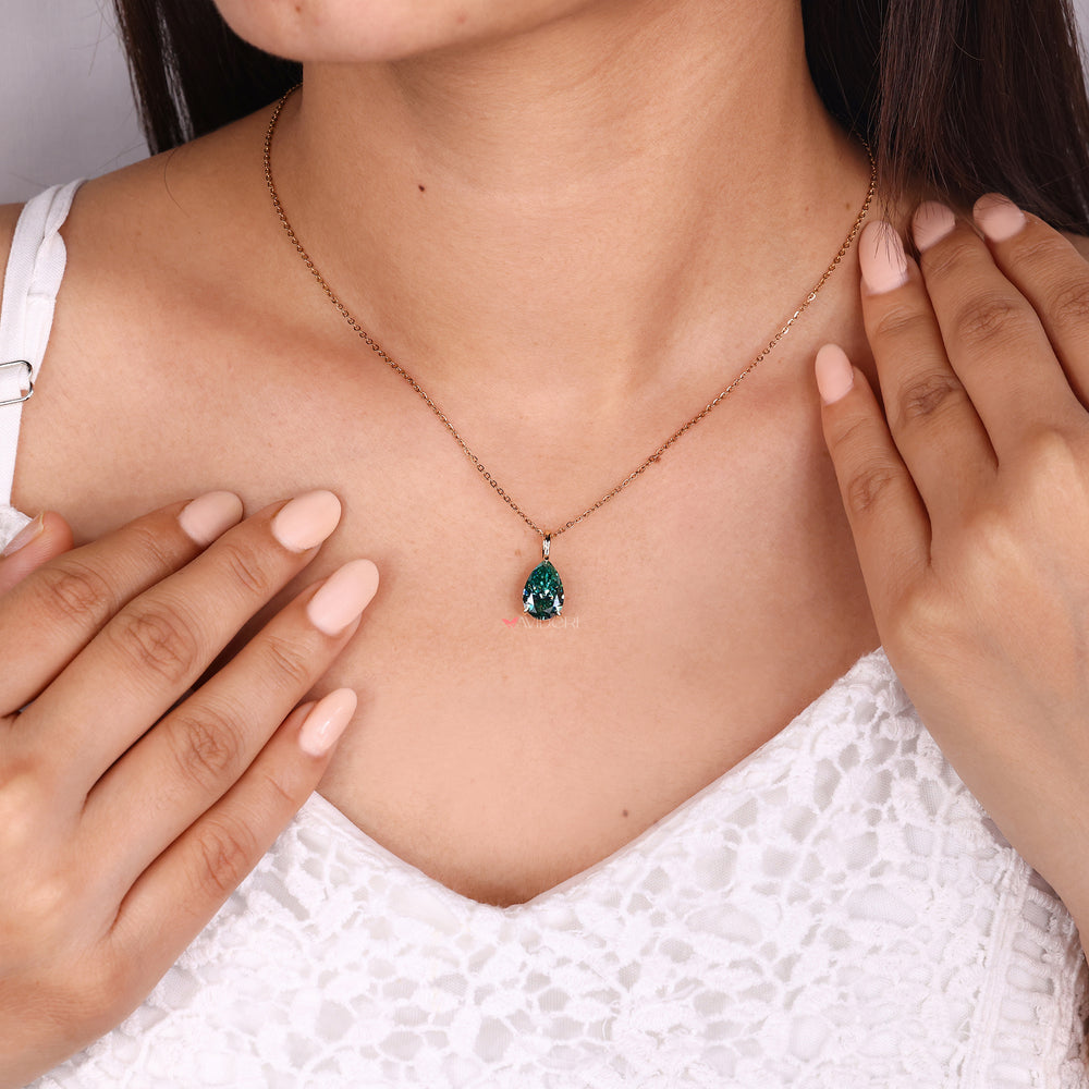 Teardrop moissanite pendant with handmade design.