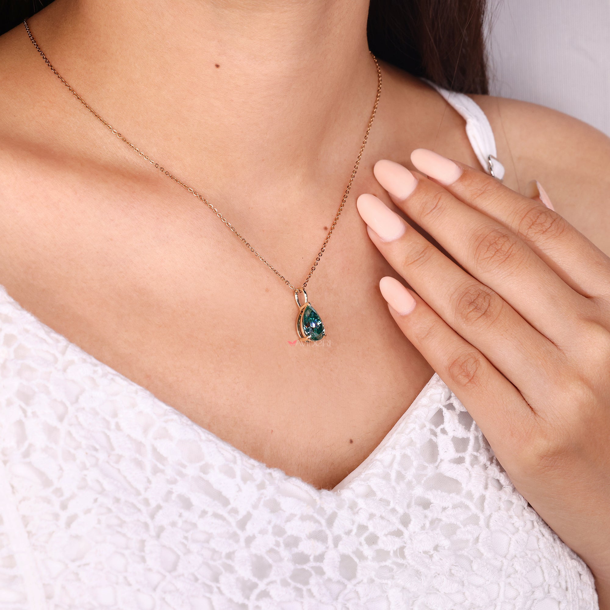 Custom moissanite pendant in solitaire style.