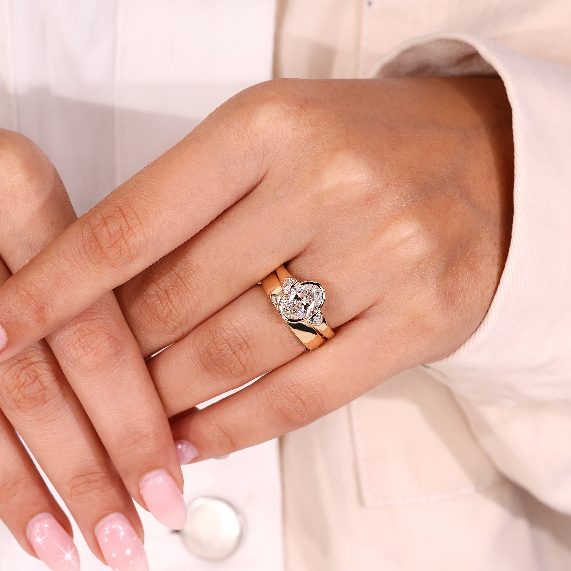 Oval diamond engagement ring in a lab grown diamond setting.