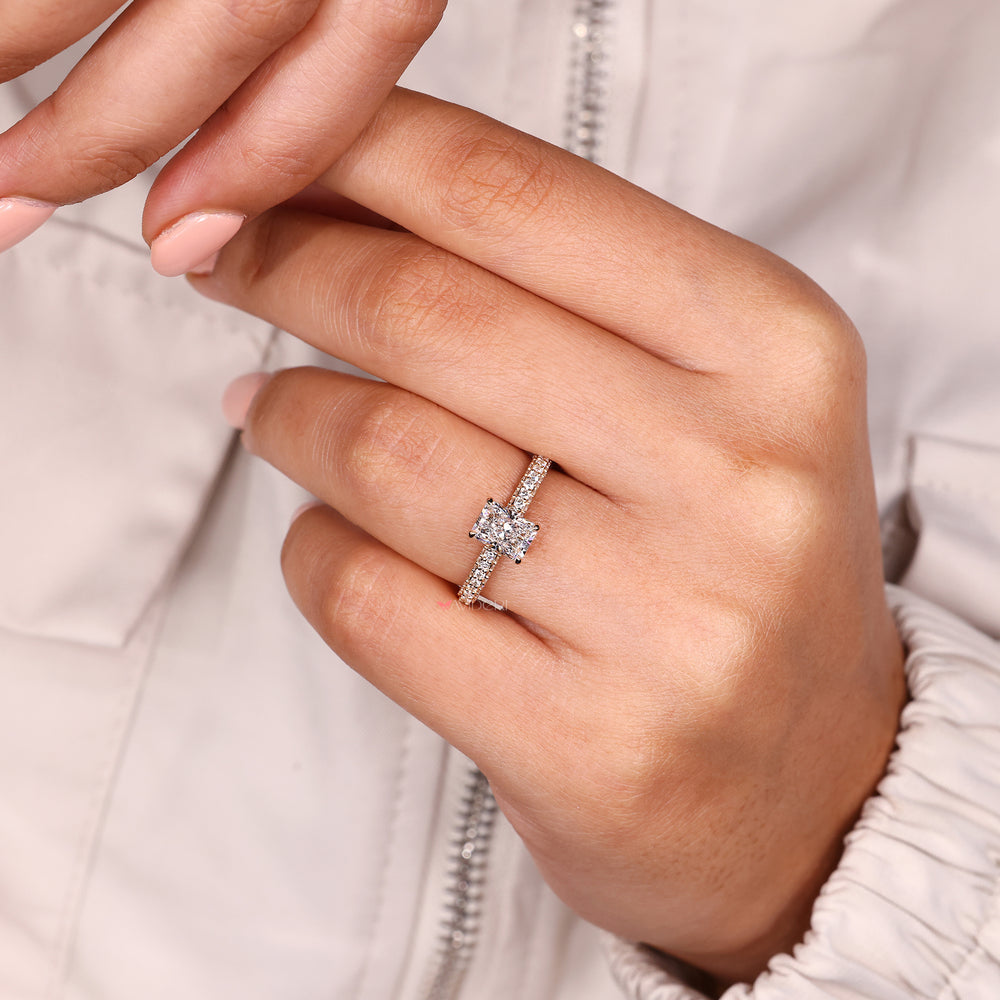 Custom radiant stone ring with 3 side pave setting.