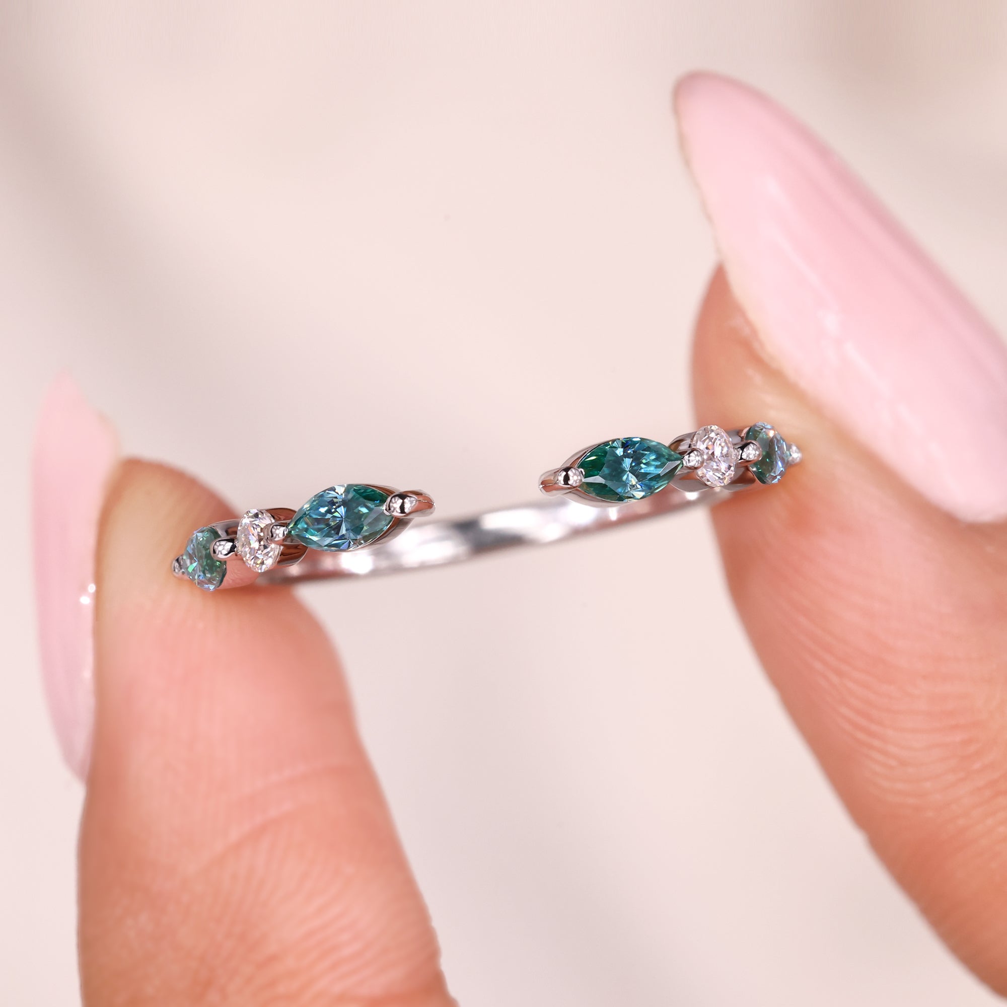 A shared prong wedding band enhances brilliance with small stones.
