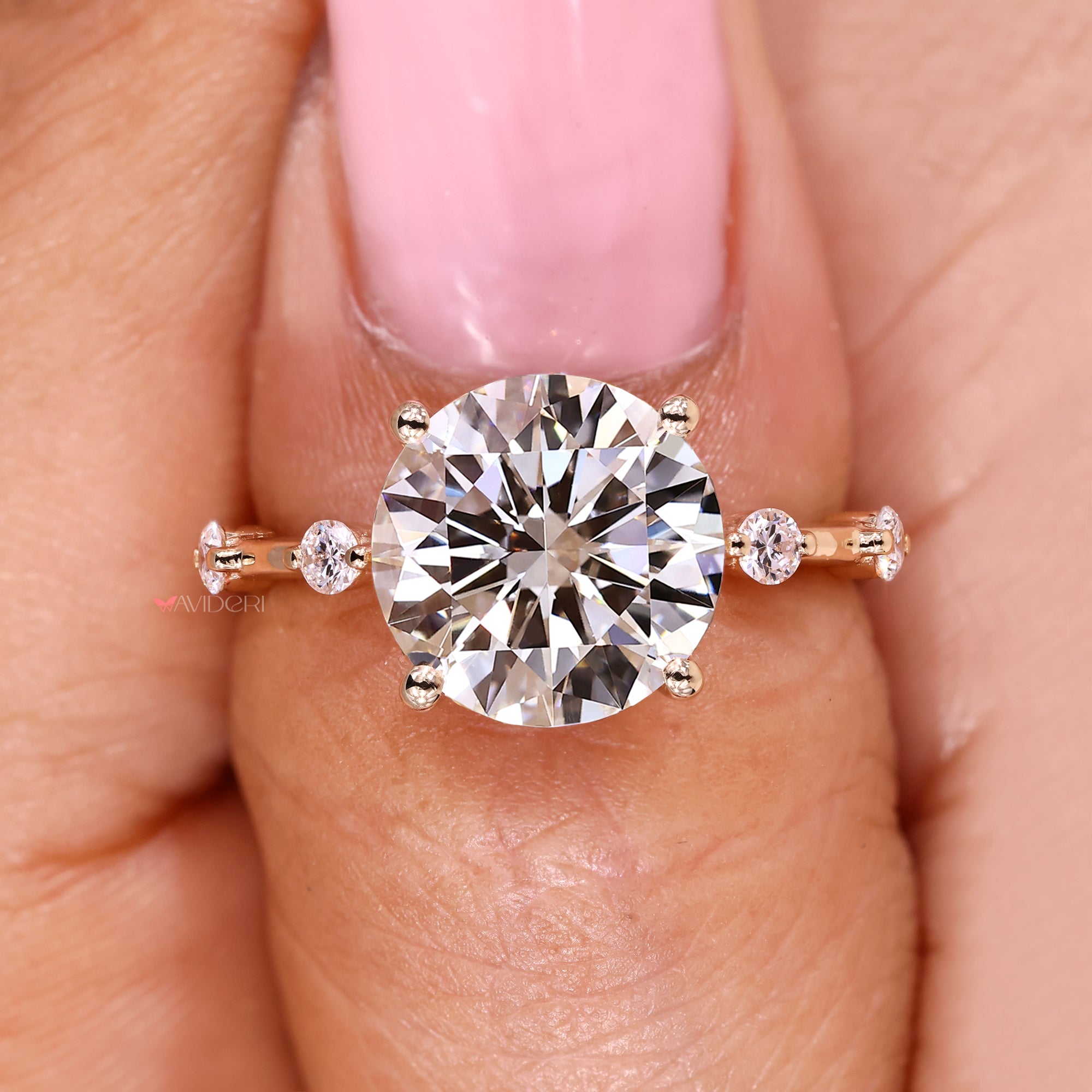 Handmade round diamond ring with distance pave.
