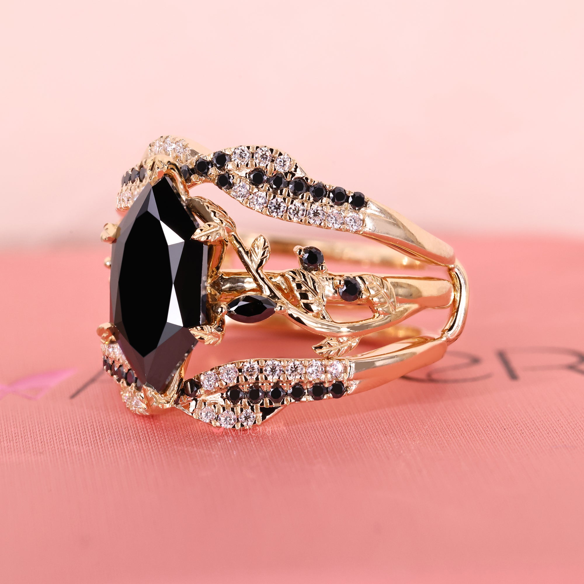 Black moissanite wedding band with six leaf style prong detailing.