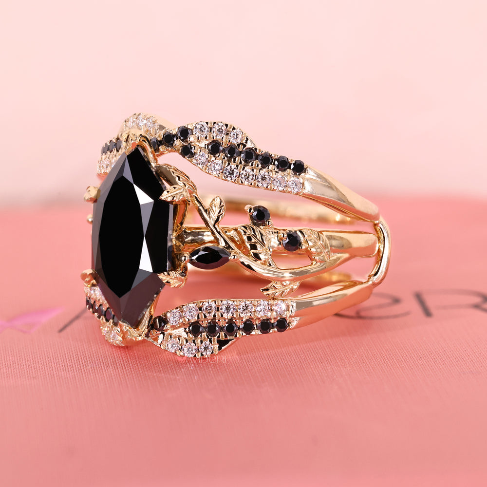 Black moissanite wedding band with six leaf style prong detailing.