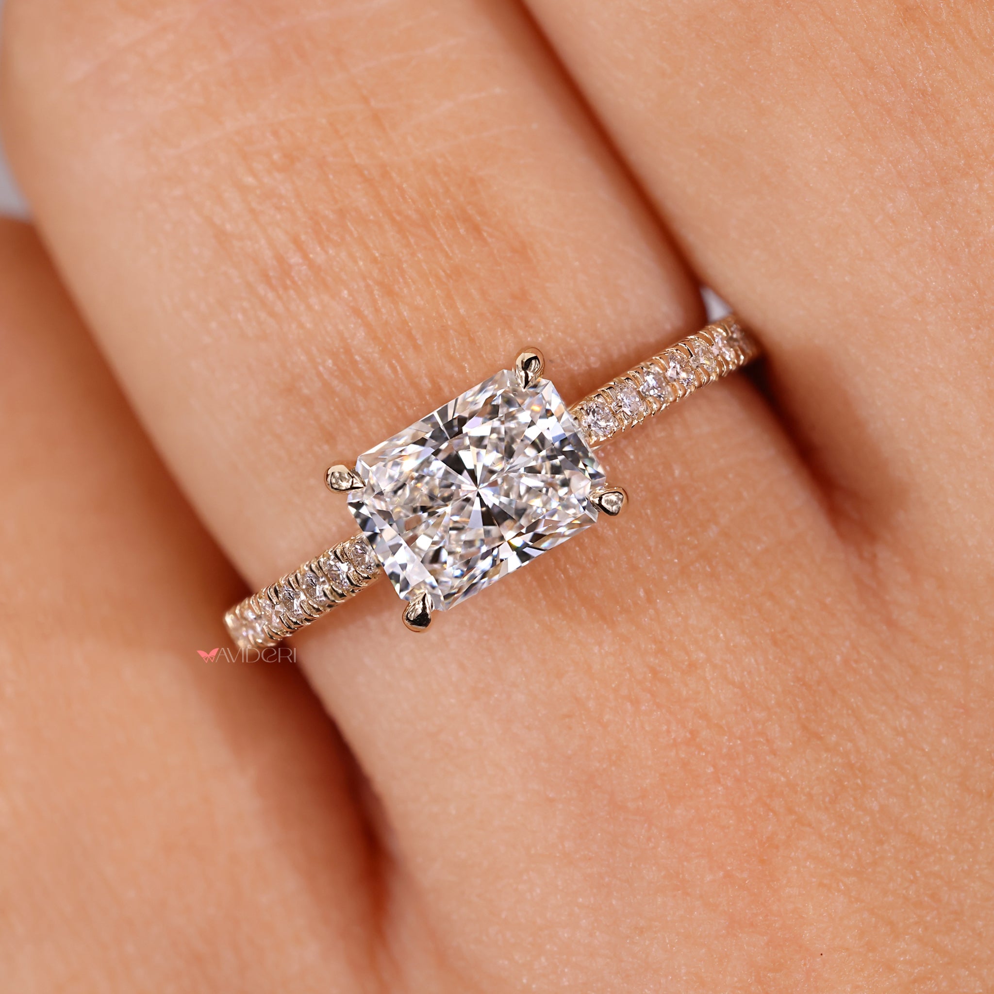 IGI certified radiant cut diamond ring with pave round diamonds.