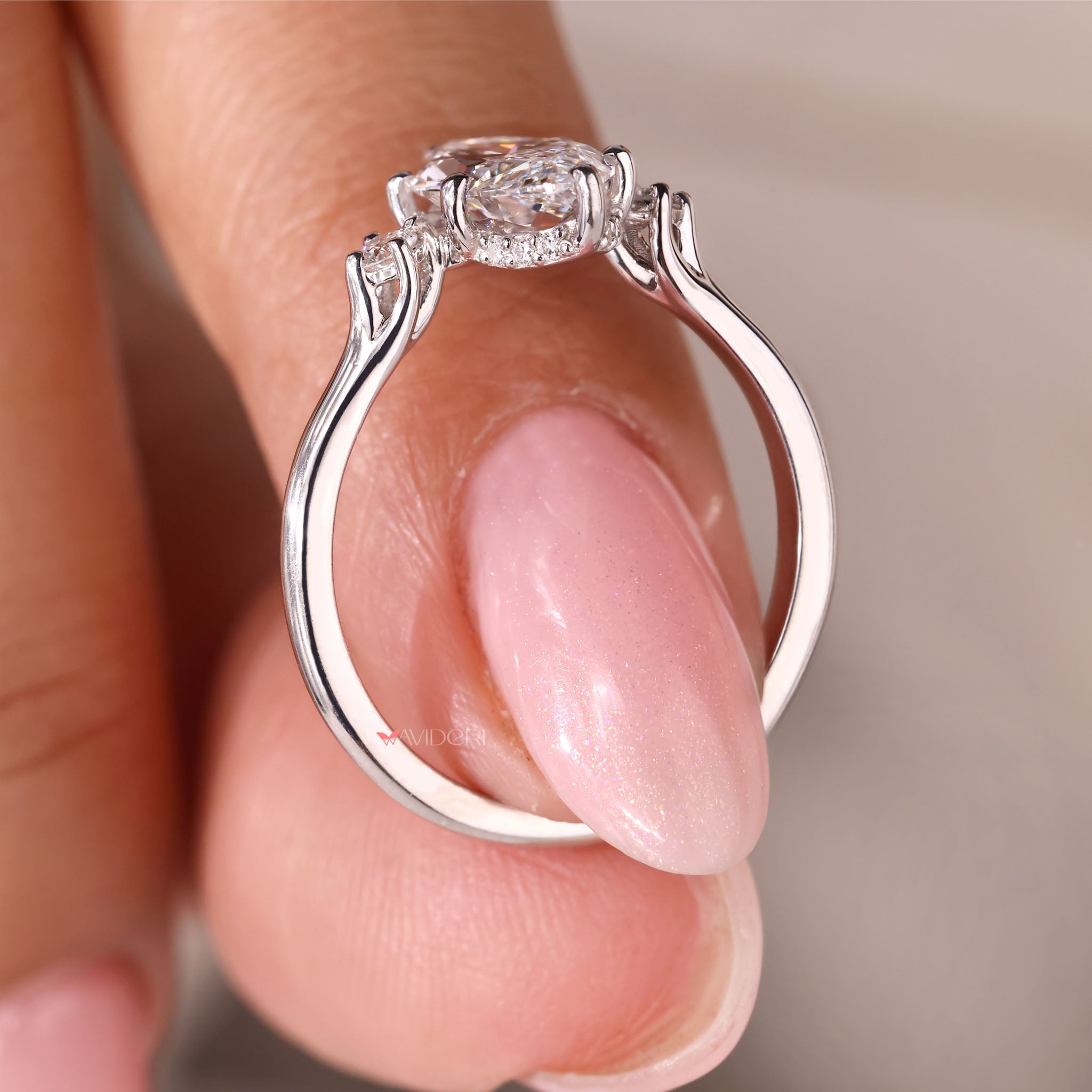 Round cut hidden halo setting with Lab Grown Diamond in shared prong