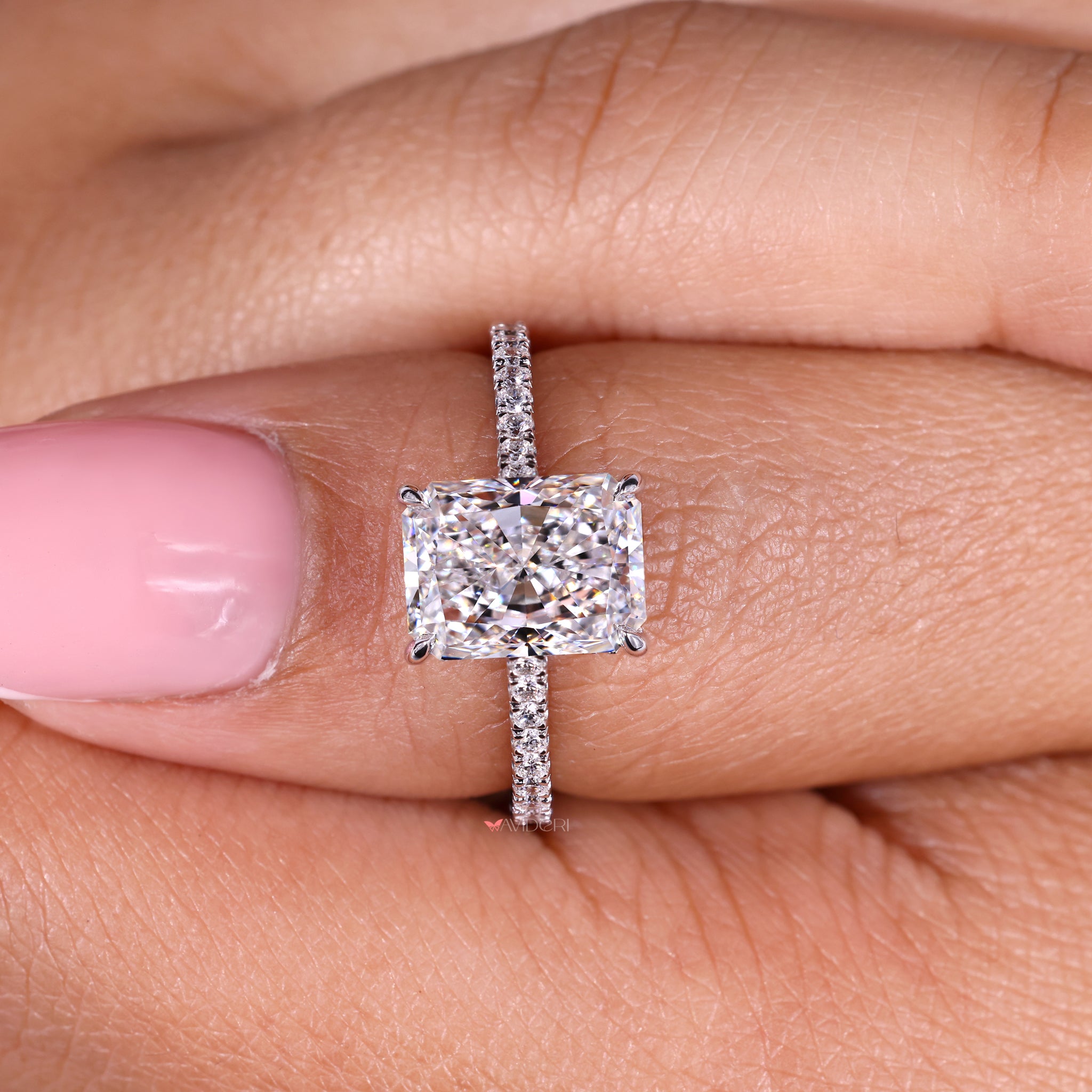 White gold ring designed to enhance the beauty of the radiant diamond
