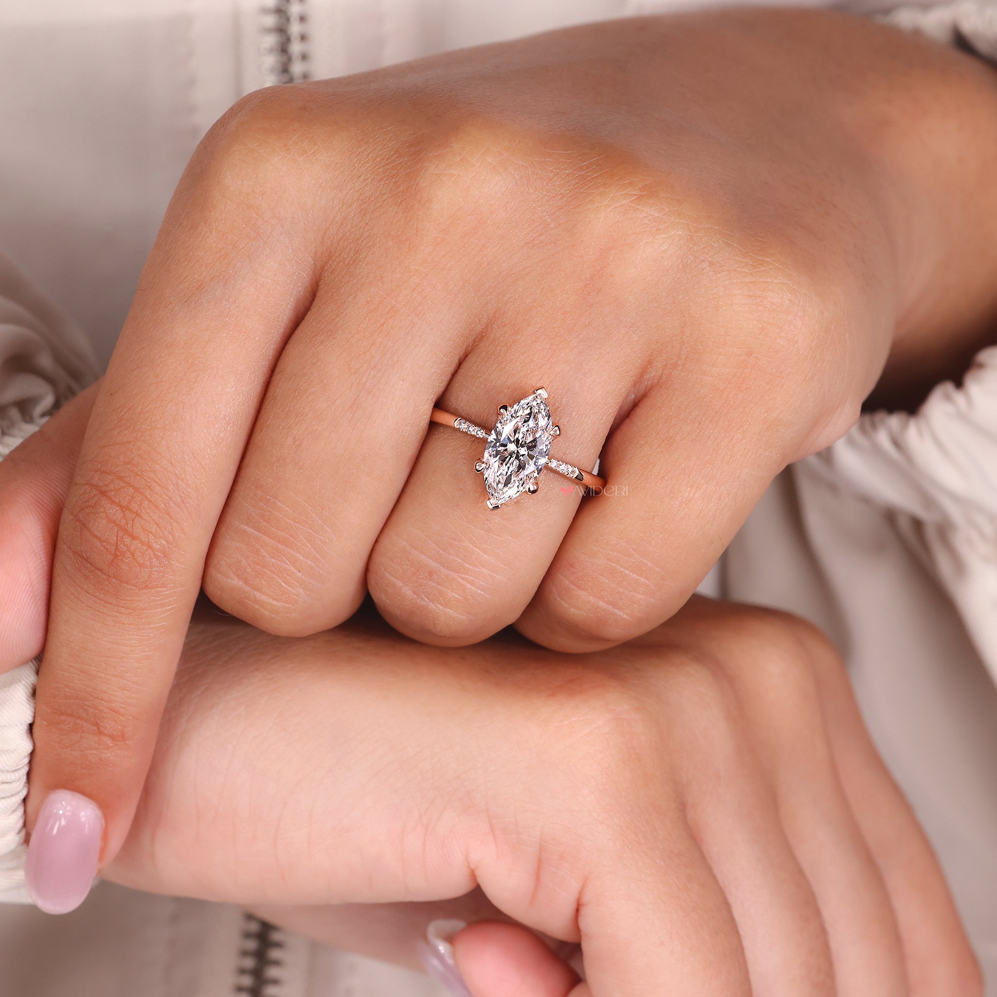 Marquise diamond ring designed with four claw prong setting for secure brilliance.
