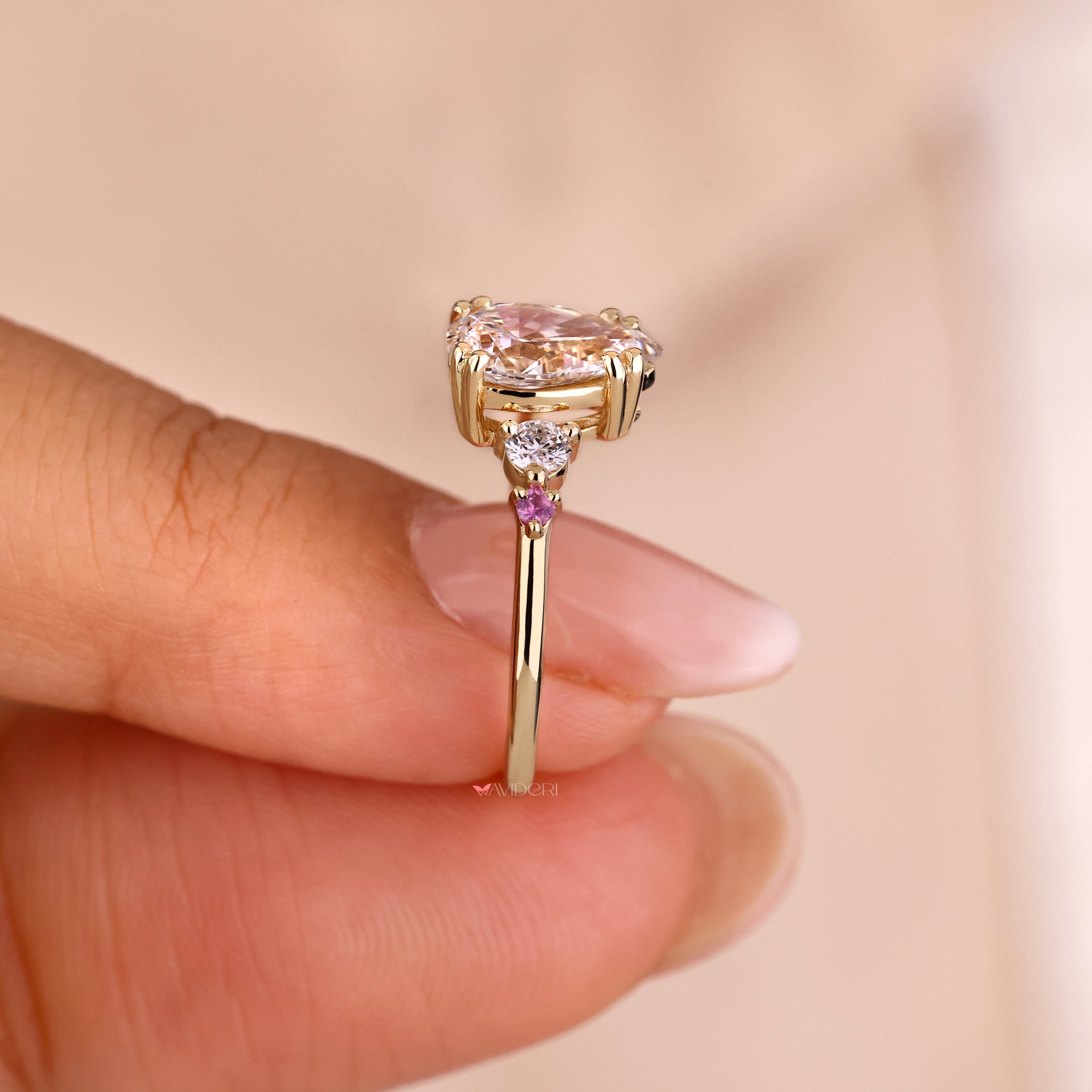 Graceful pink sapphire engagement ring for a bold and romantic statement.
