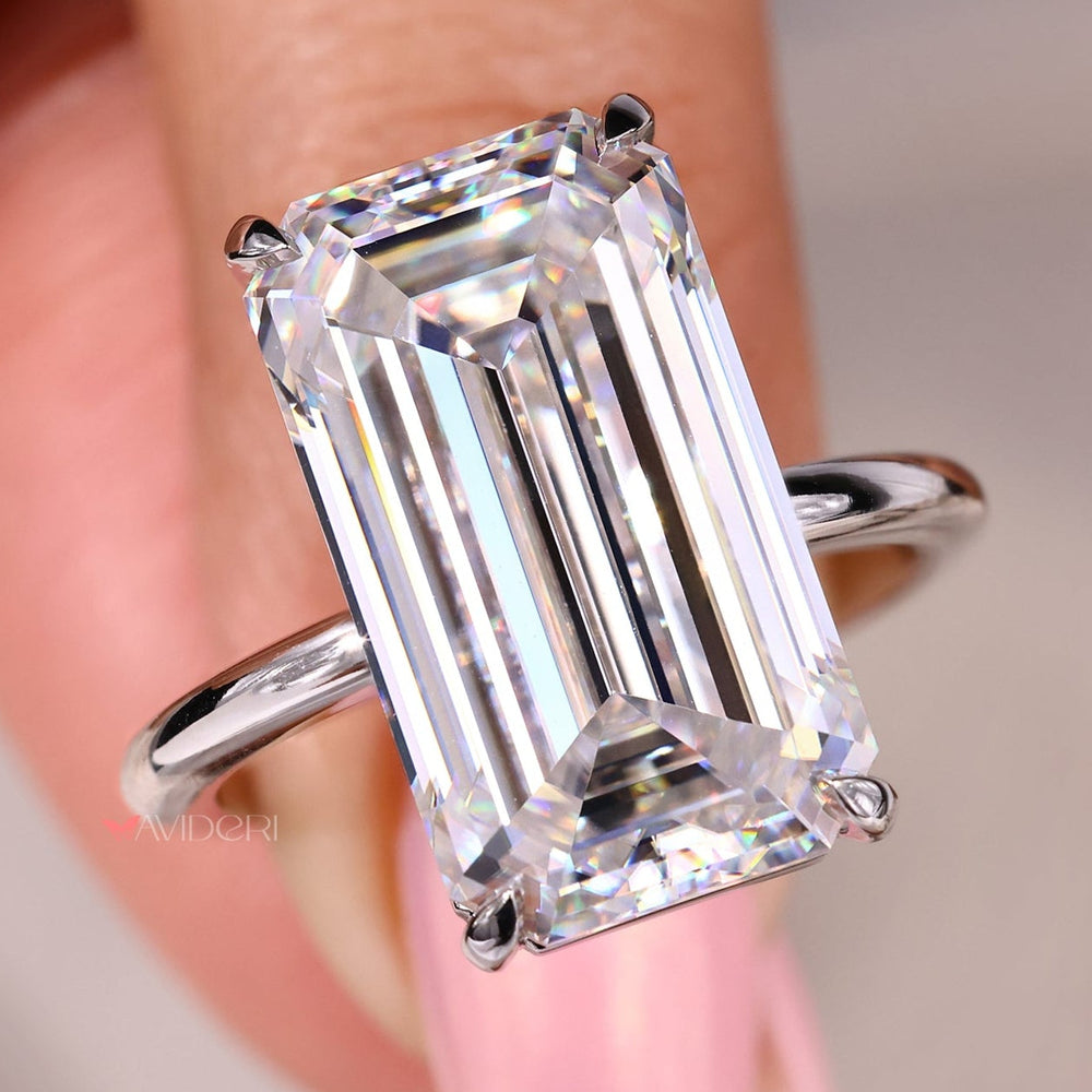 Handmade ring with a big moissanite stone and 4 claw prong setting.

